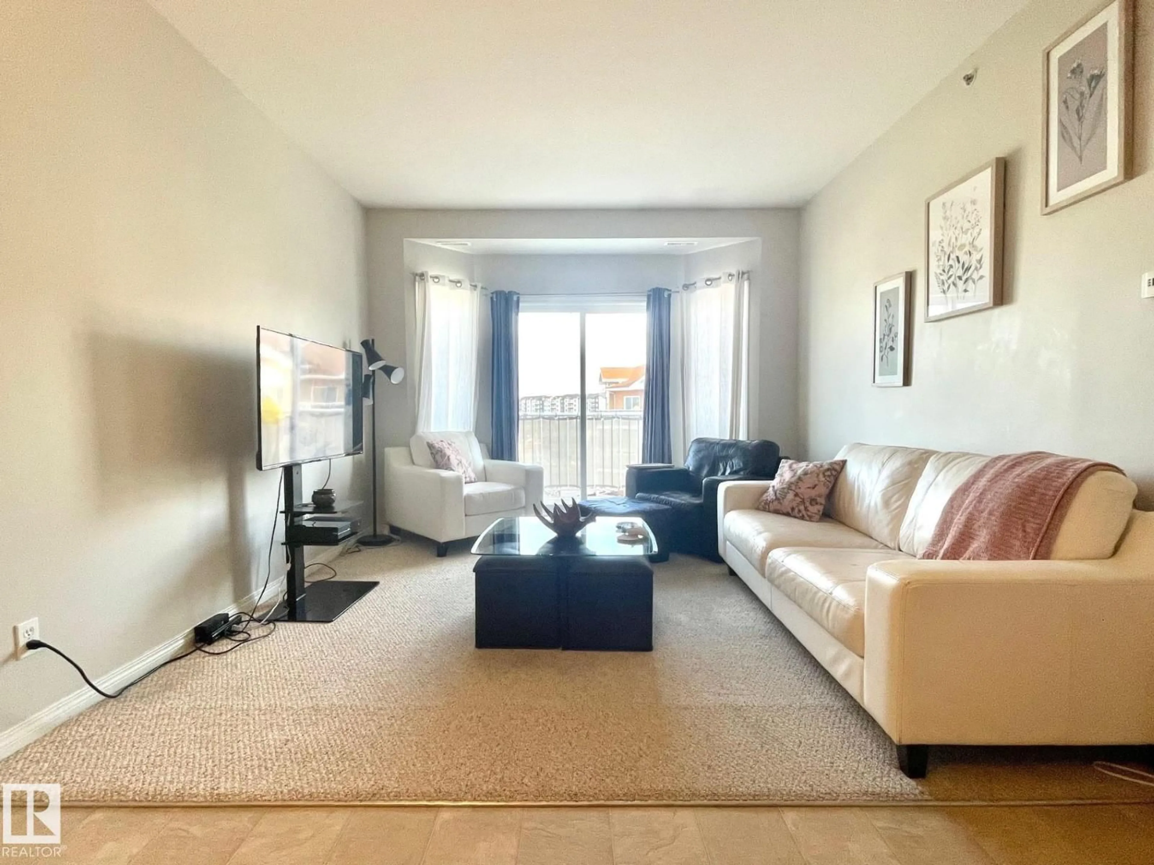 Living room with furniture, unknown for #407 - 4304 139 AV, Edmonton Alberta T5Y0H6