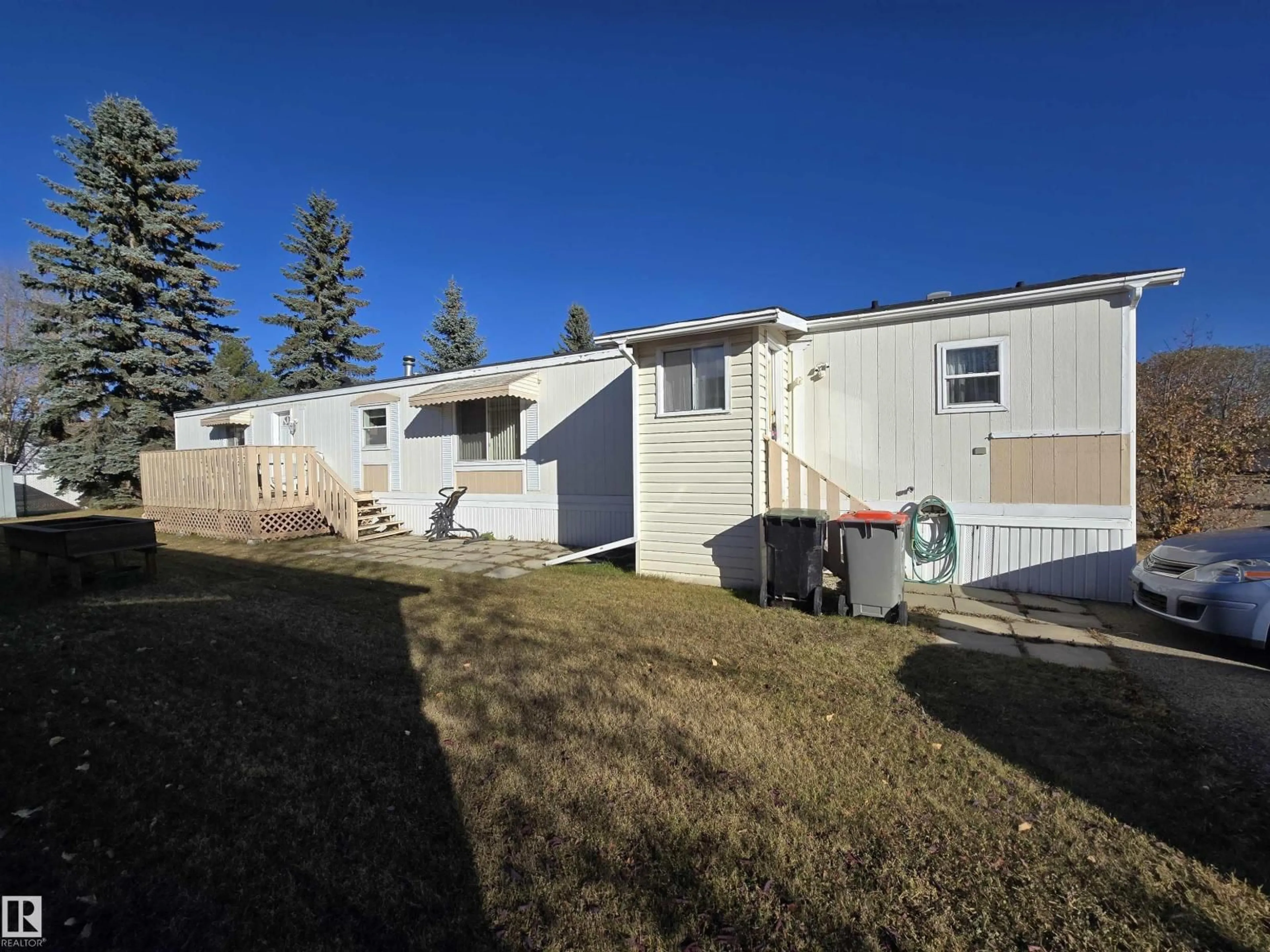 A pic from outside/outdoor area/front of a property/back of a property/a pic from drone, unknown for 21 4819 51 AV, Millet Alberta T0C1Z0
