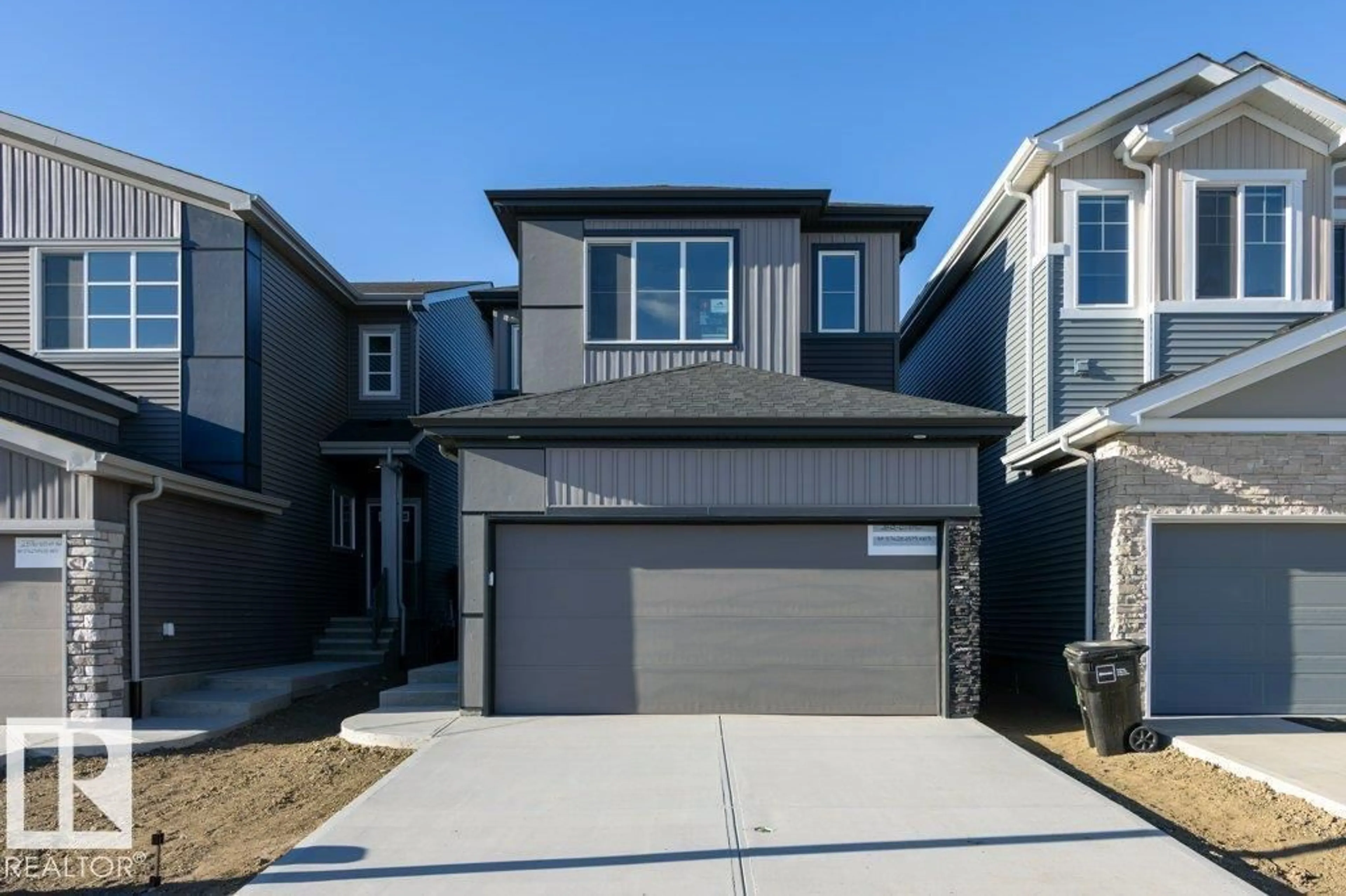 Home with vinyl exterior material, street for SW - 2832 65 ST, Edmonton Alberta T6X3J7