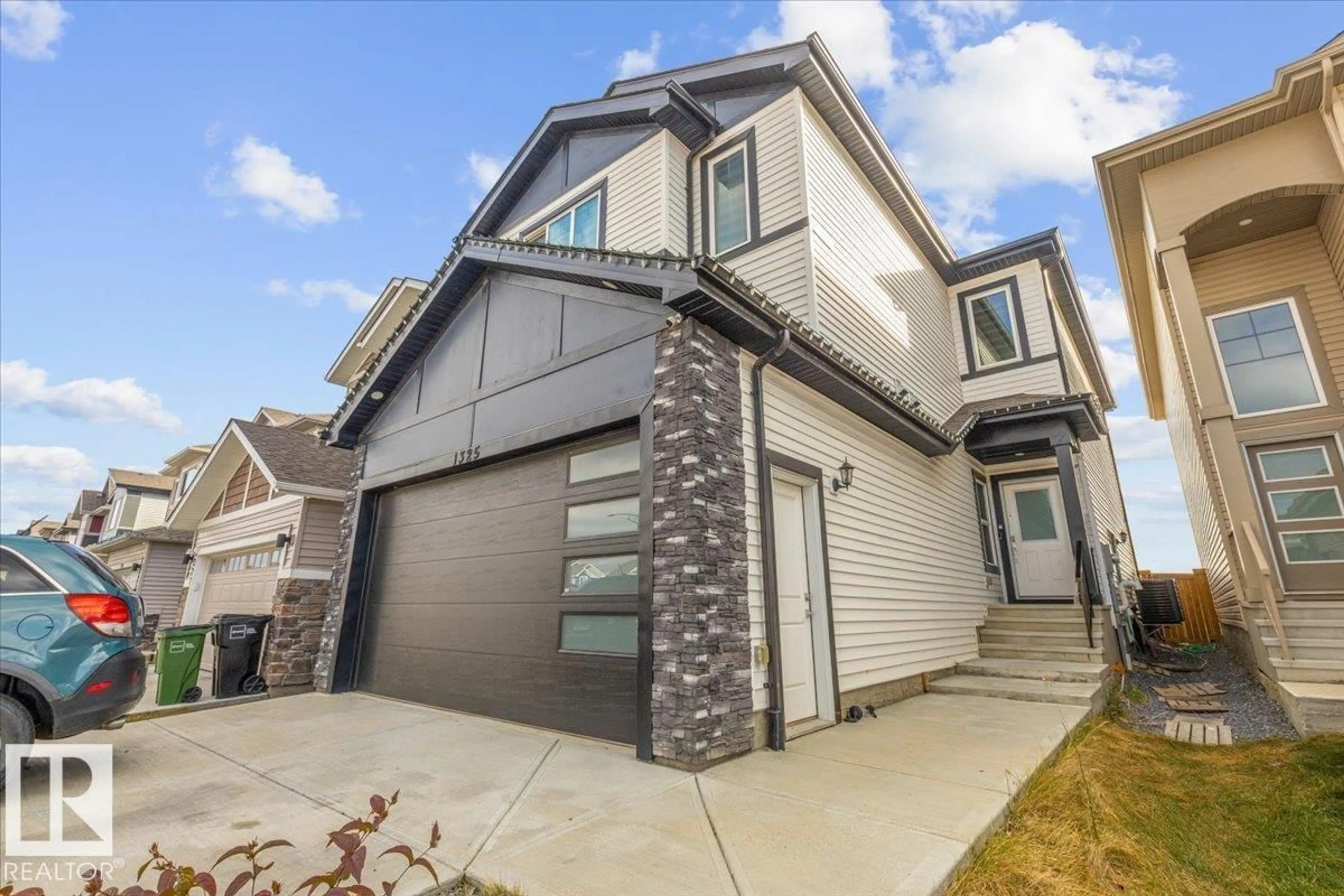 Home with vinyl exterior material, street for NW - 1325 20 ST, Edmonton Alberta T6T2R8