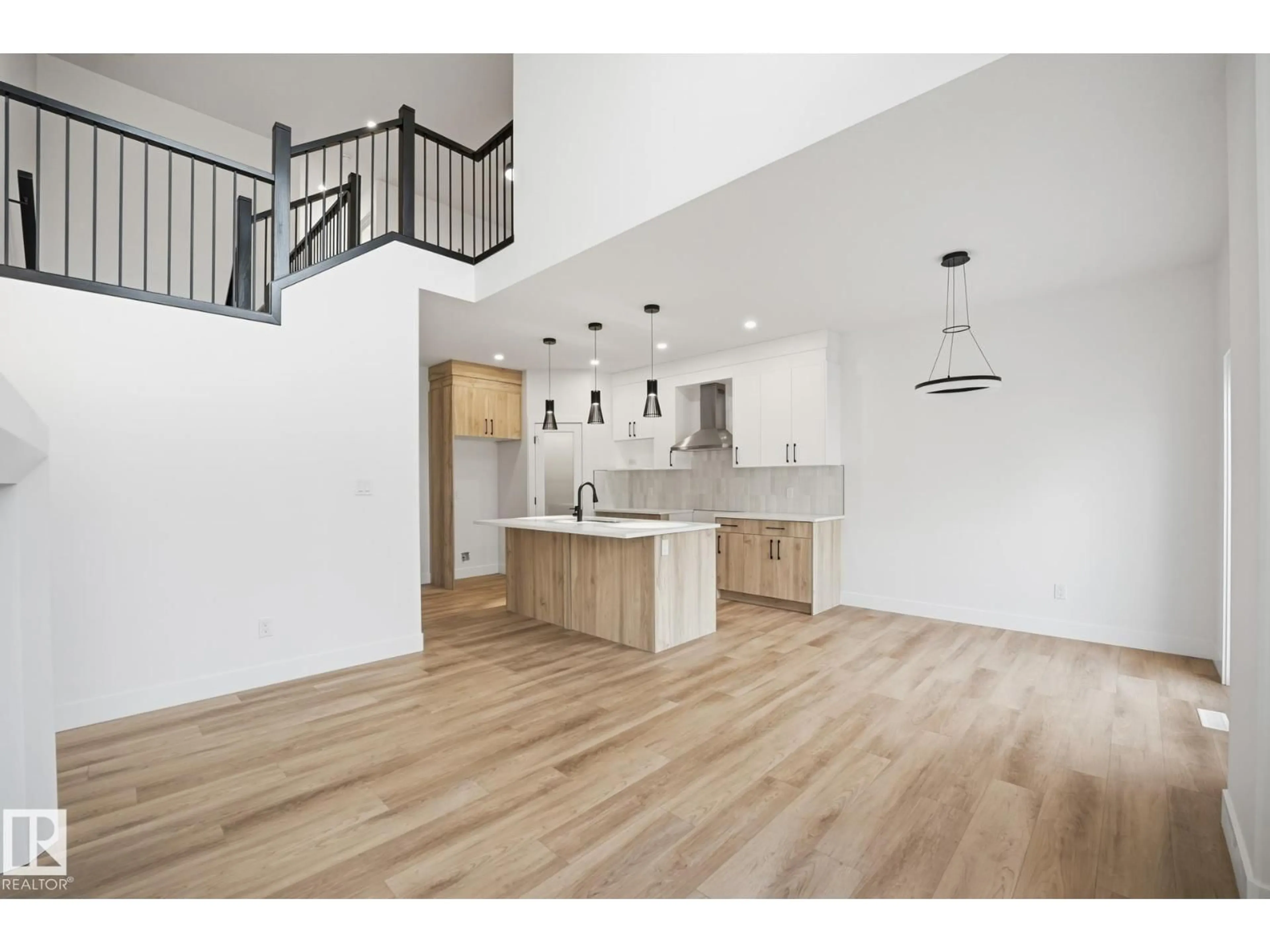 Open concept kitchen, wood/laminate floor for 113 HILTON COVE, Spruce Grove Alberta T7X1Y4
