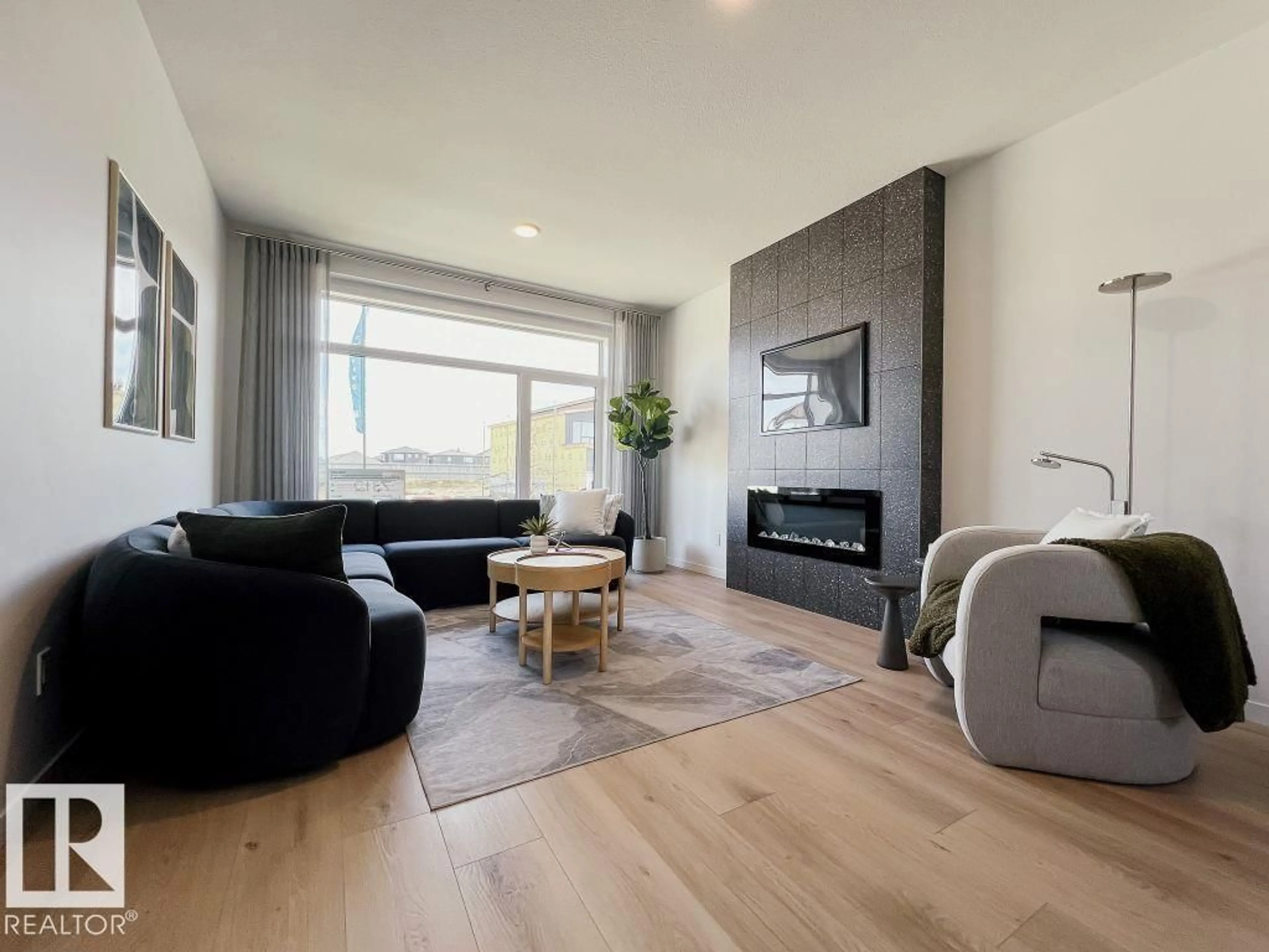 Living room with furniture, wood/laminate floor for 5100 PARC REUNIS WY, Beaumont Alberta T4X3E4