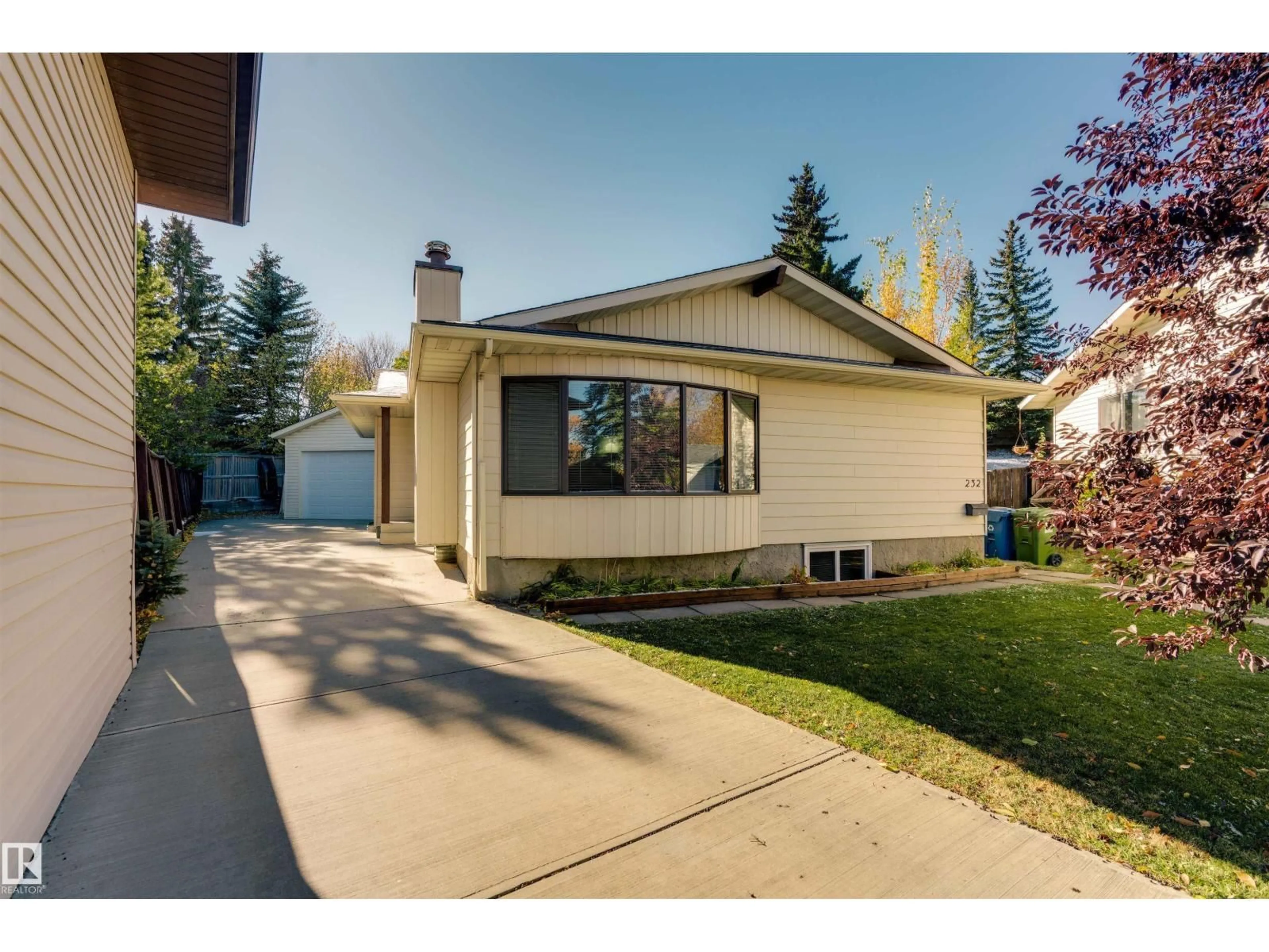 Home with vinyl exterior material, street for 232 RACHVIEW PL, Calgary Alberta T4G1R7