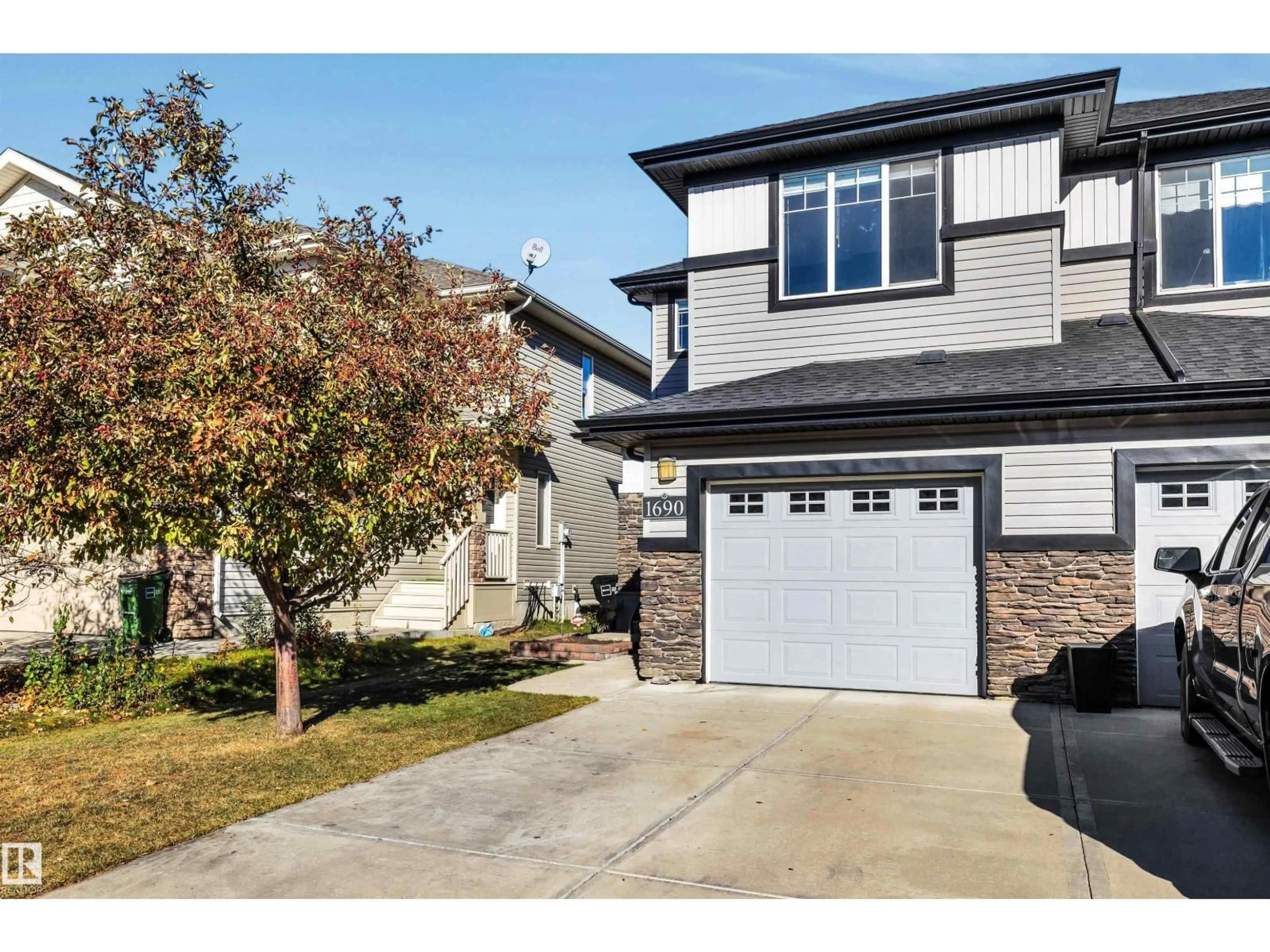 Home with vinyl exterior material, street for 1690 CUNNINGHAM WY, Edmonton Alberta T6W0W5
