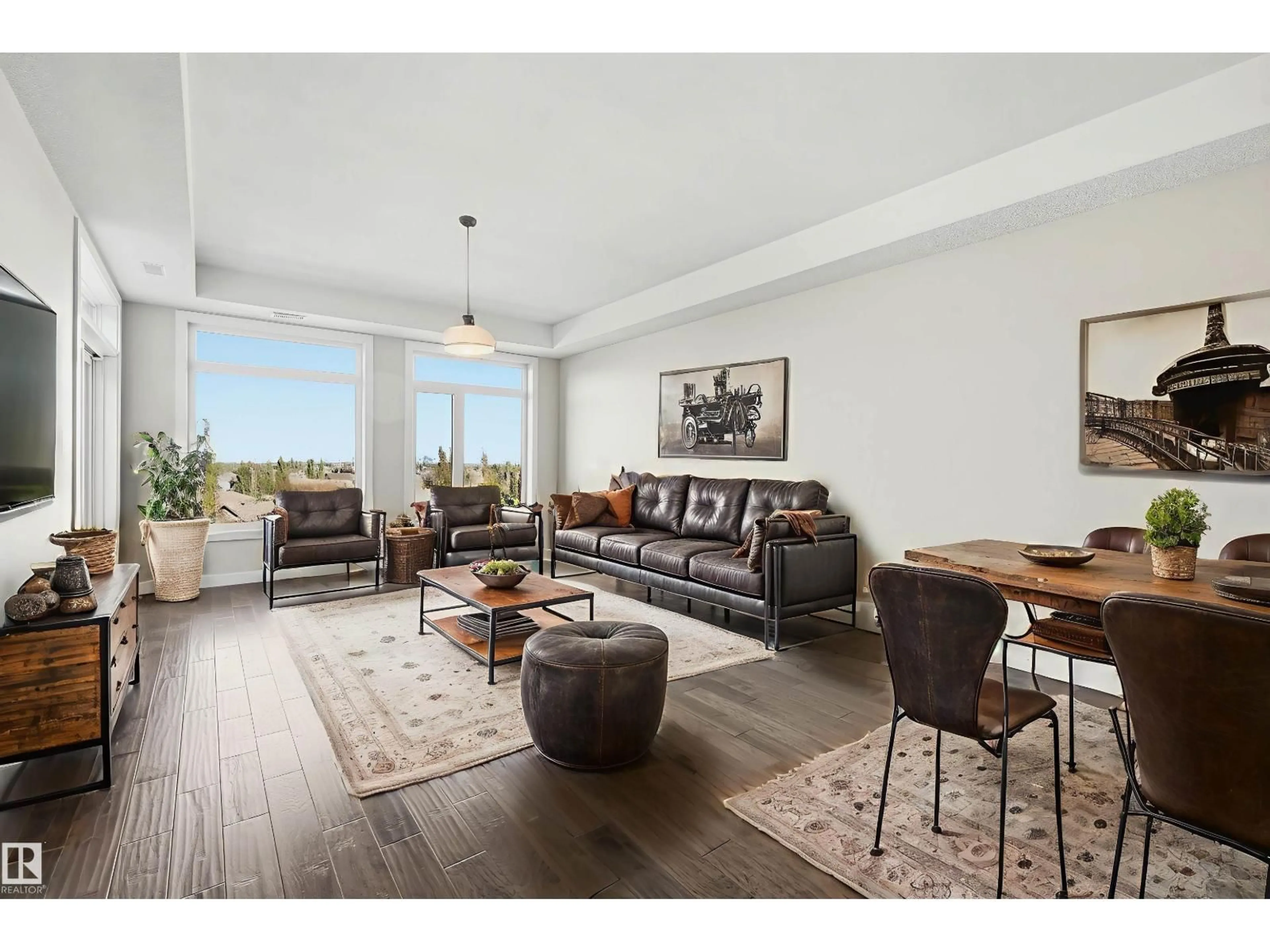Living room with furniture, wood/laminate floor for #413 - 625 LEGER WY, Edmonton Alberta T6R0W4