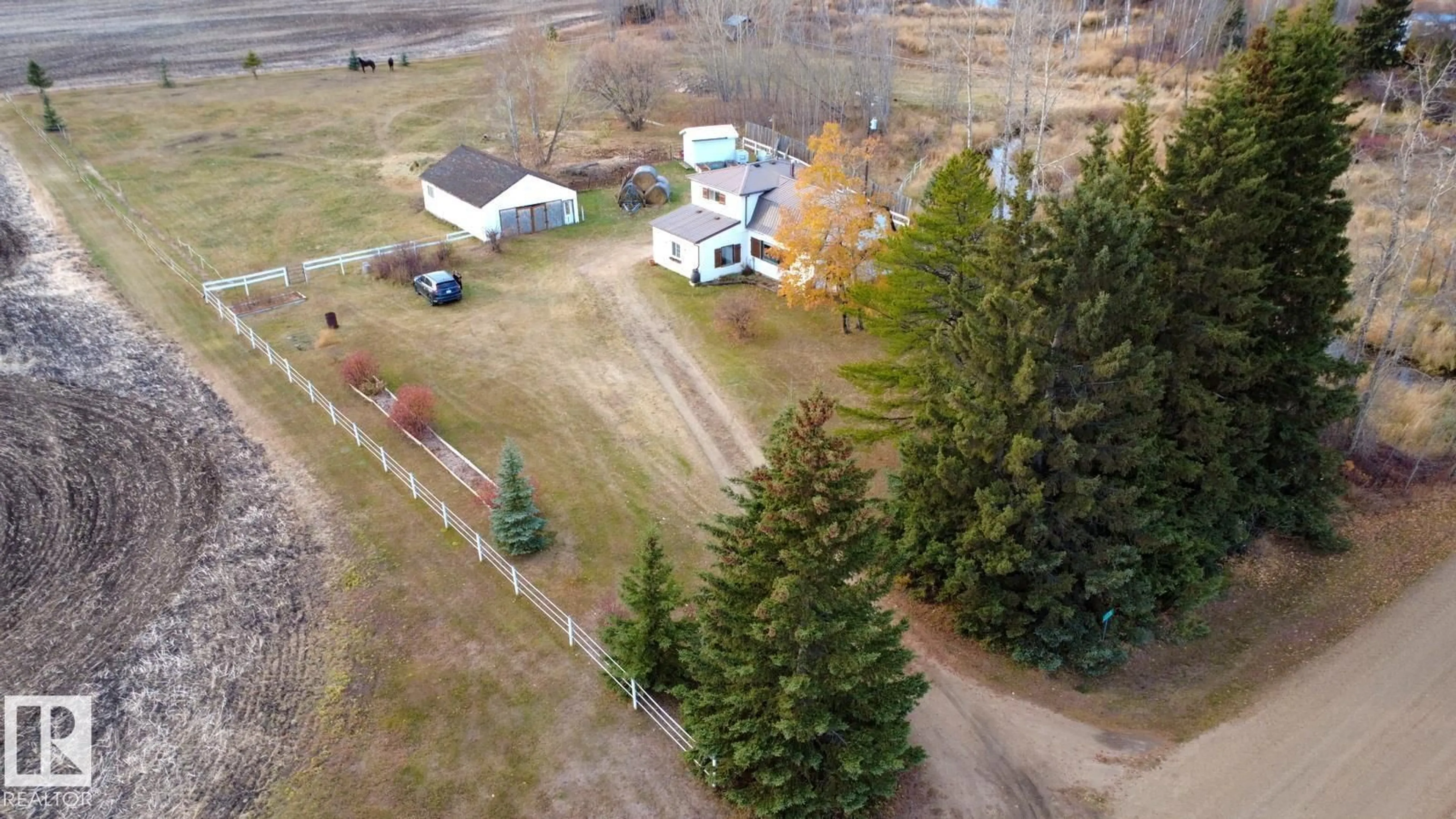 A pic from outside/outdoor area/front of a property/back of a property/a pic from drone, unknown for Jarvie - 63114 RGE RD 270, Rural Westlock County Alberta T0G1H0
