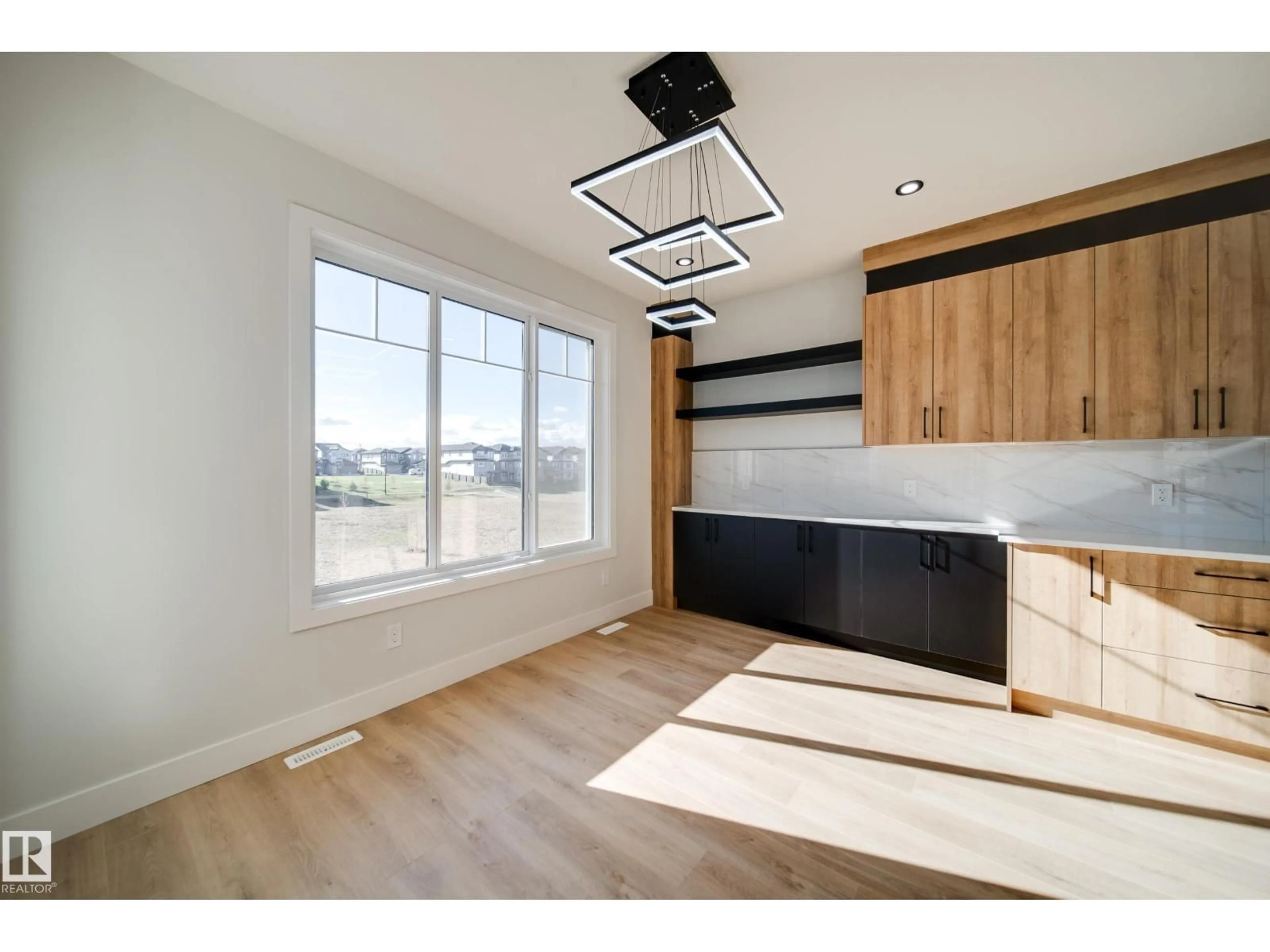 Open concept kitchen, wood/laminate floor for NW - 8511 183 AV, Edmonton Alberta T5Z0X5