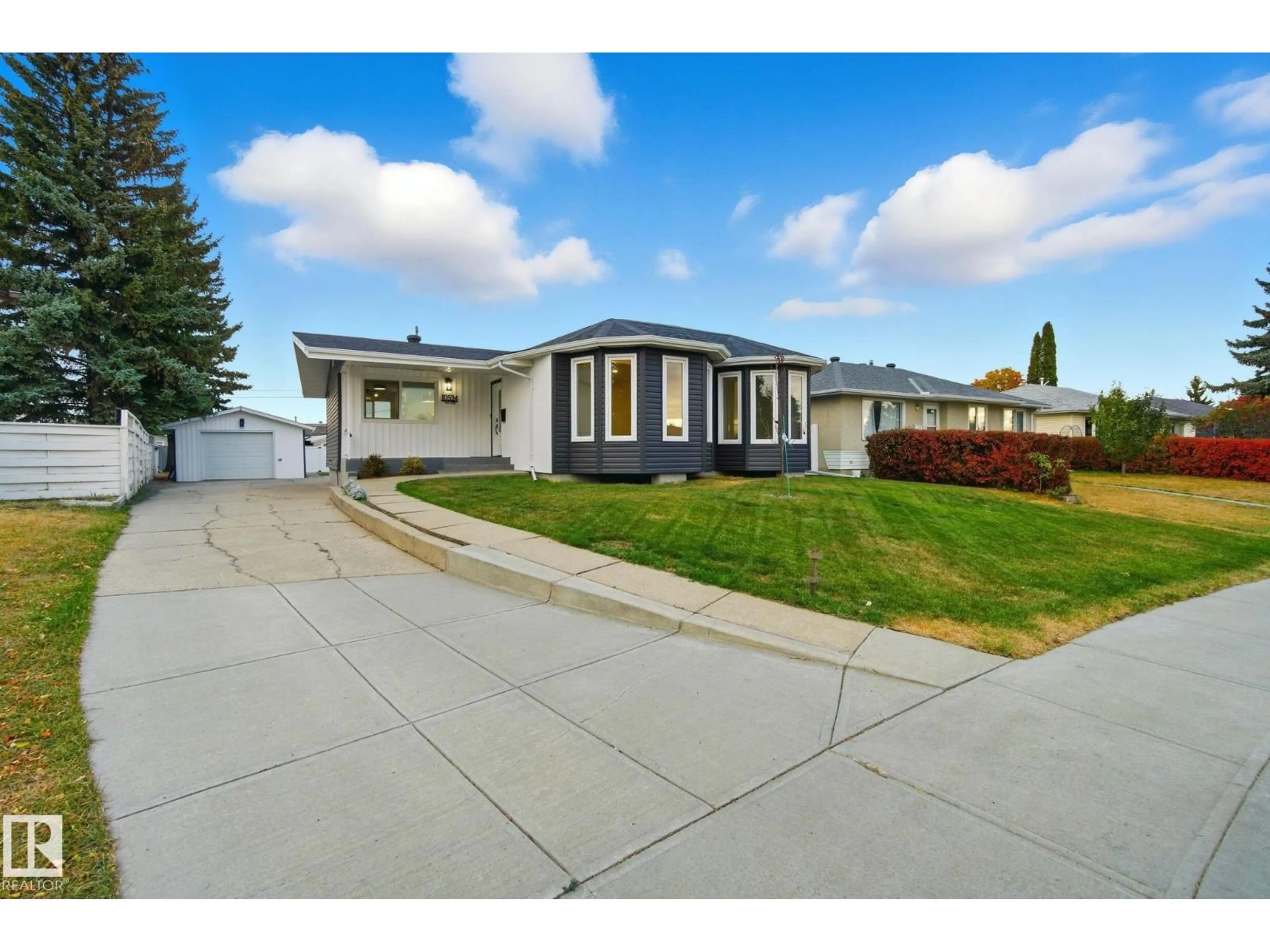 Home with vinyl exterior material, street for 10524 134 AV, Edmonton Alberta T5E1J6