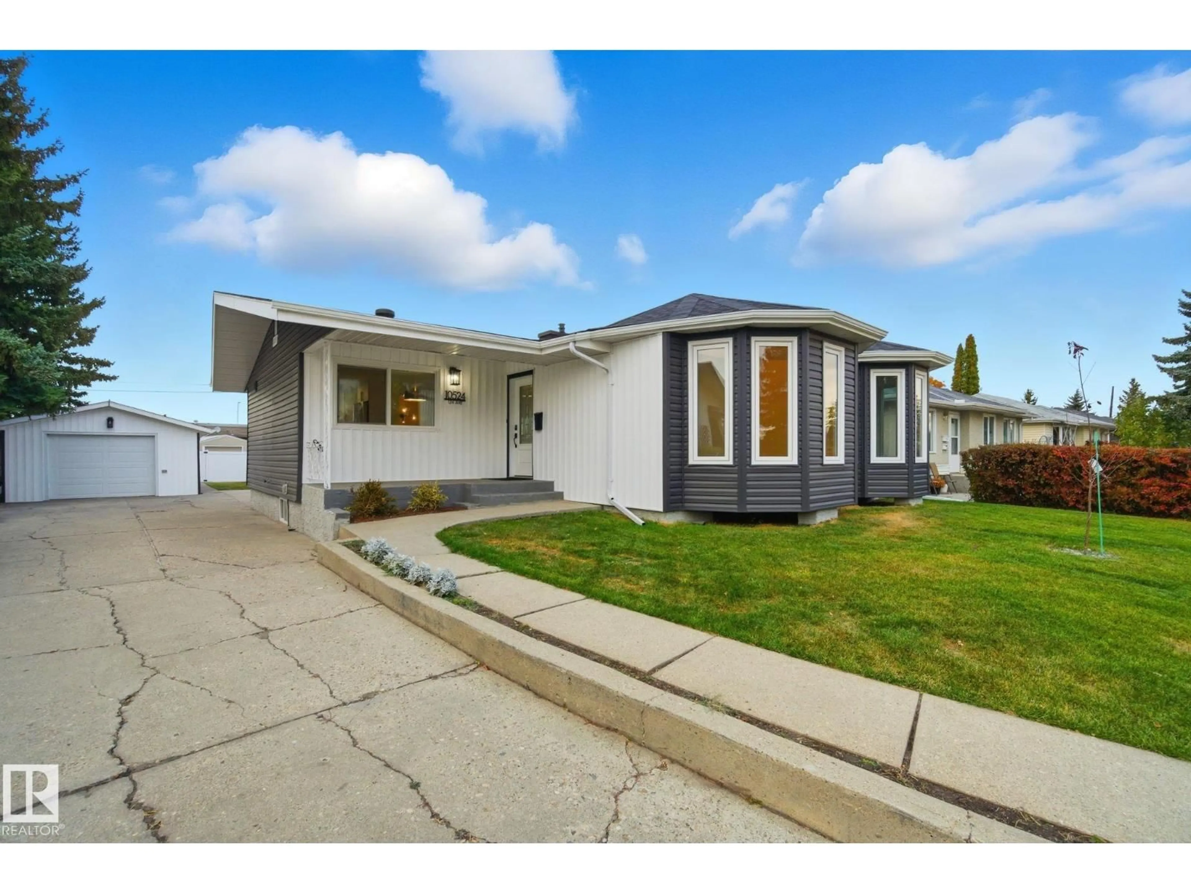 Home with vinyl exterior material, street for 10524 134 AV, Edmonton Alberta T5E1J6
