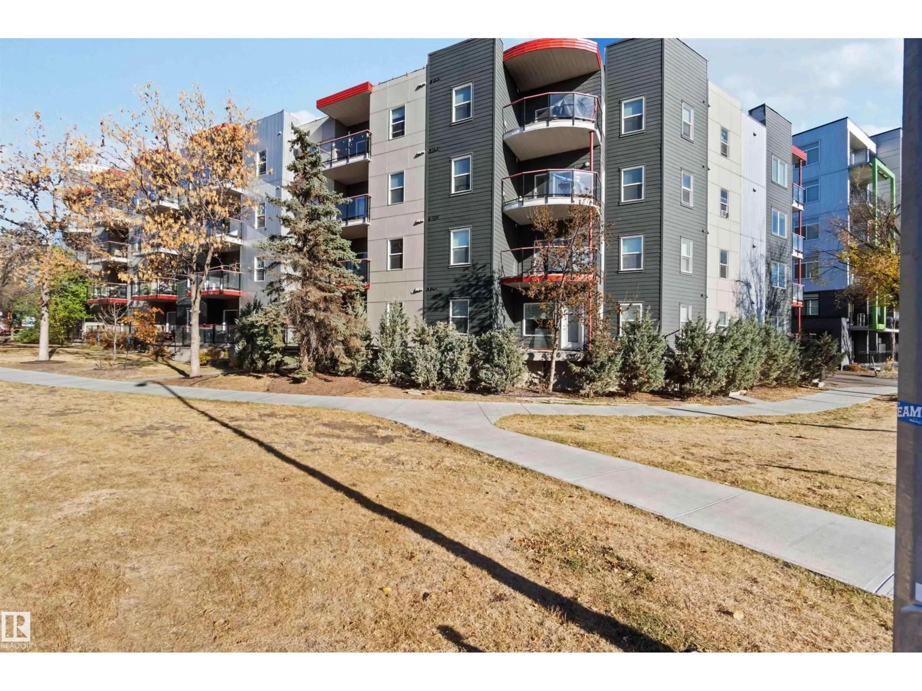 A pic from outside/outdoor area/front of a property/back of a property/a pic from drone, street for #107 - 10611 117 ST NW, Edmonton Alberta T5H0G6