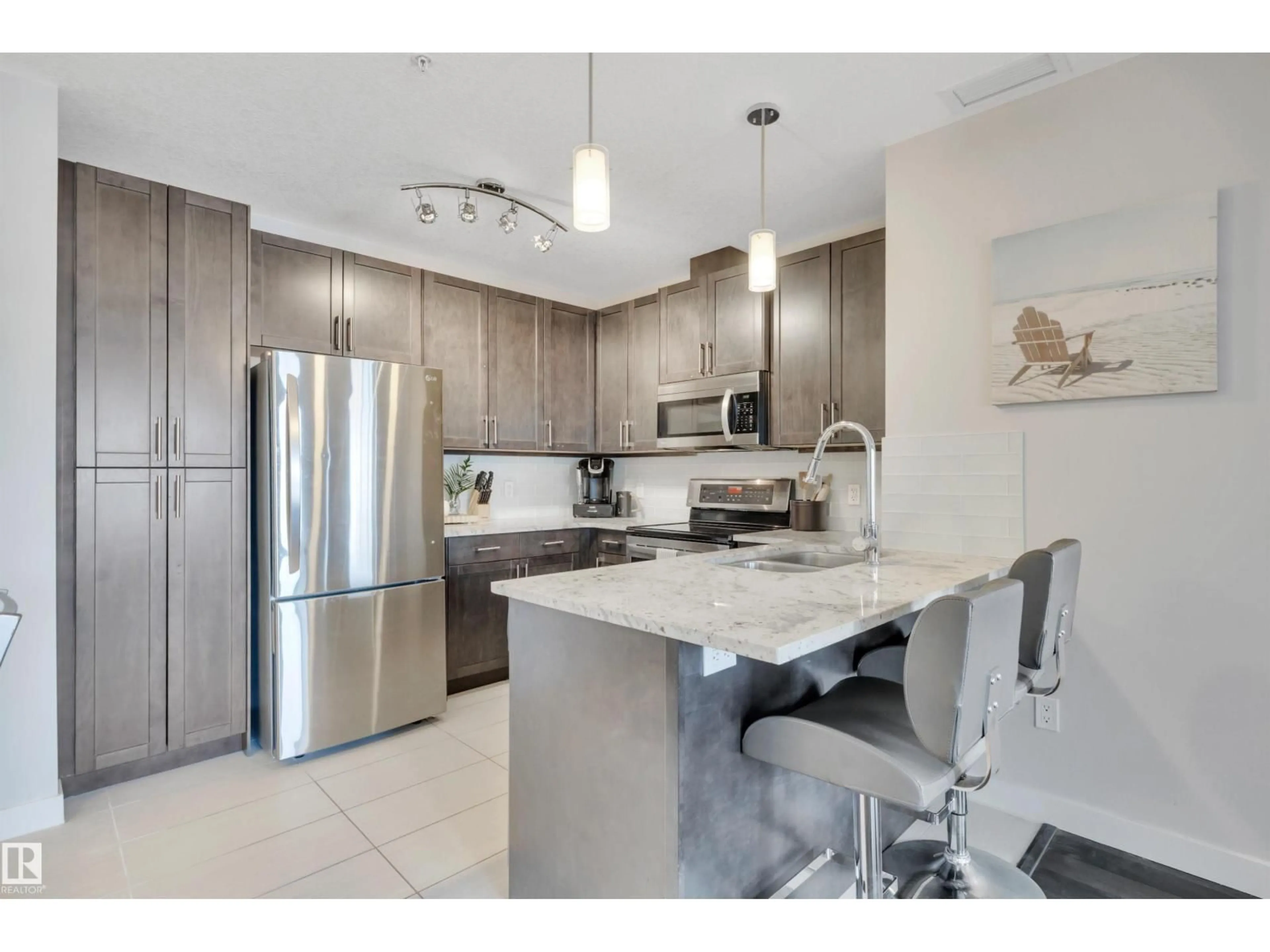 Open concept kitchen, ceramic/tile floor for #214E - 5151 WINDERMERE BV, Edmonton Alberta T6W2K4