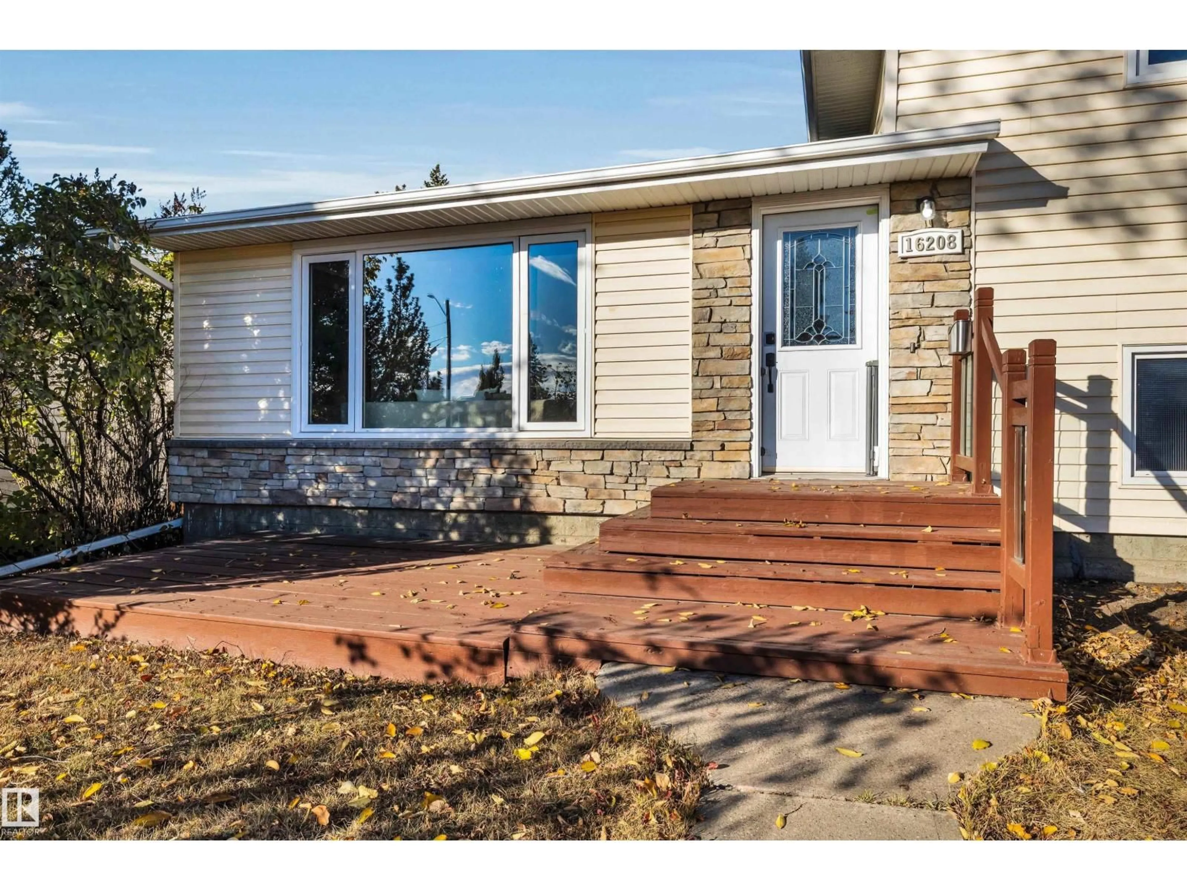 Home with vinyl exterior material, street for 16208 87 AV, Edmonton Alberta T5R4G9