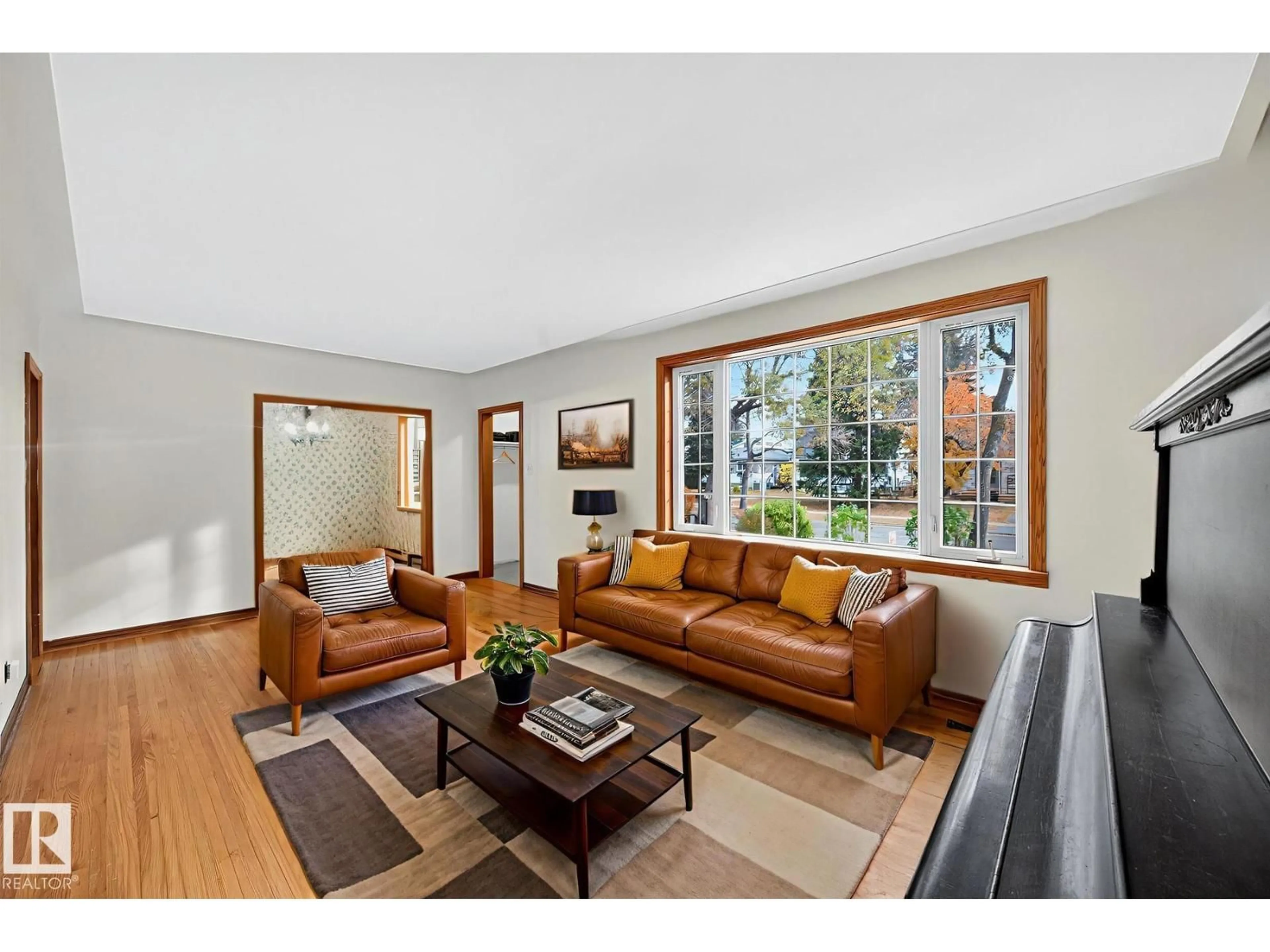 Living room with furniture, wood/laminate floor for 6806 112A ST, Edmonton Alberta T6H3K6