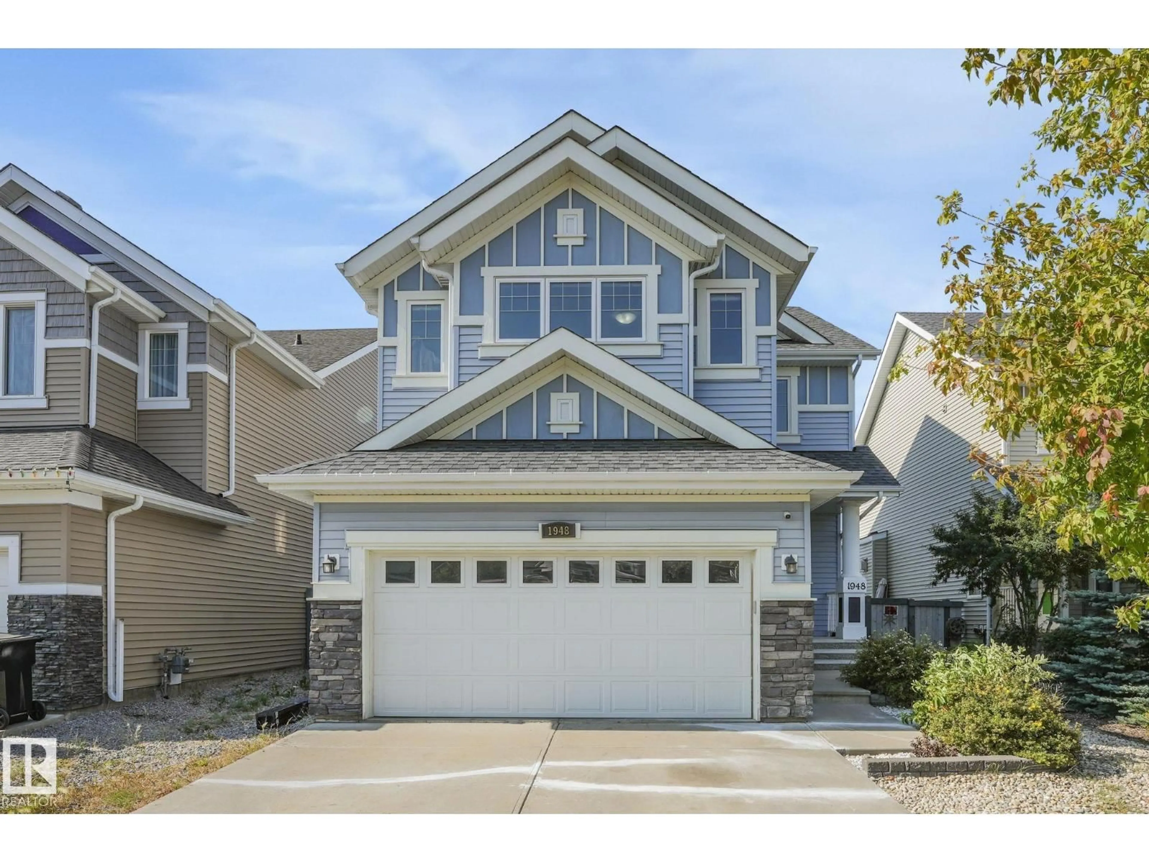 Home with vinyl exterior material, street for SW - 1948 78 ST, Edmonton Alberta T6X1W3