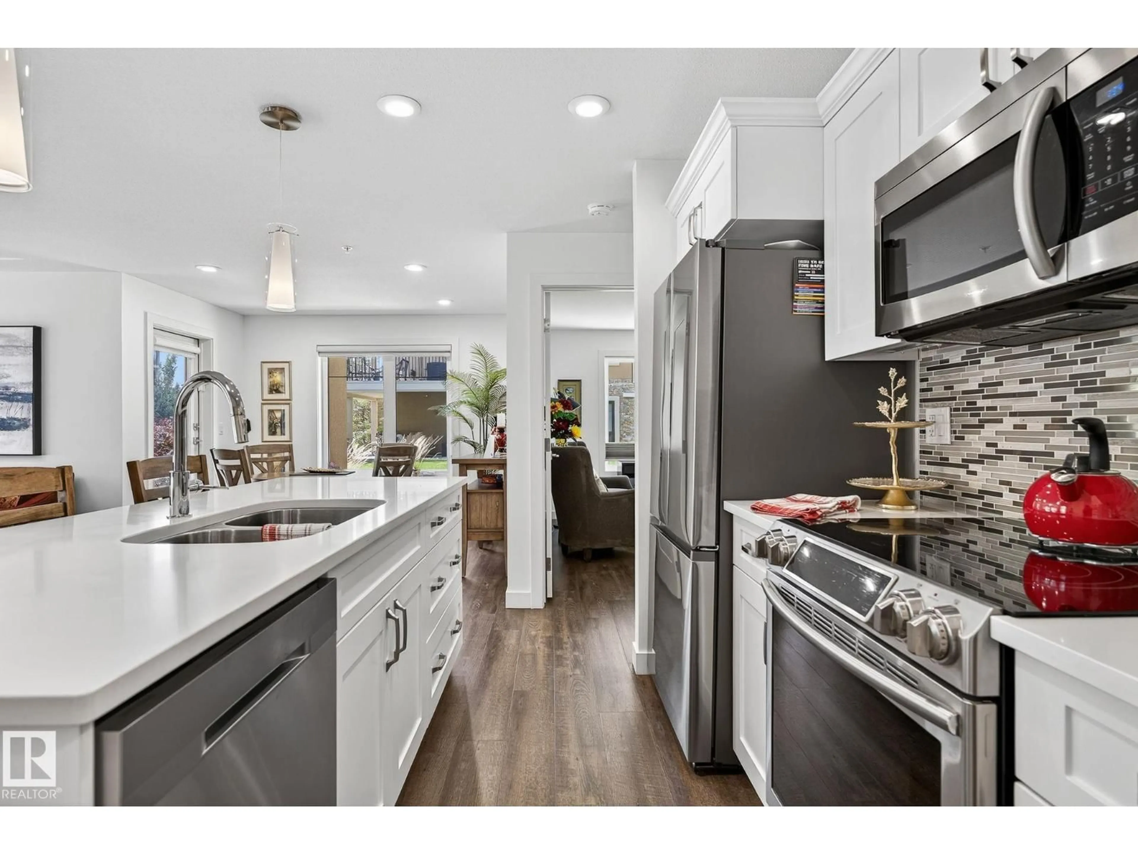 Open concept kitchen, ceramic/tile floor for #102 - 1029 173 ST, Edmonton Alberta T6W3E4