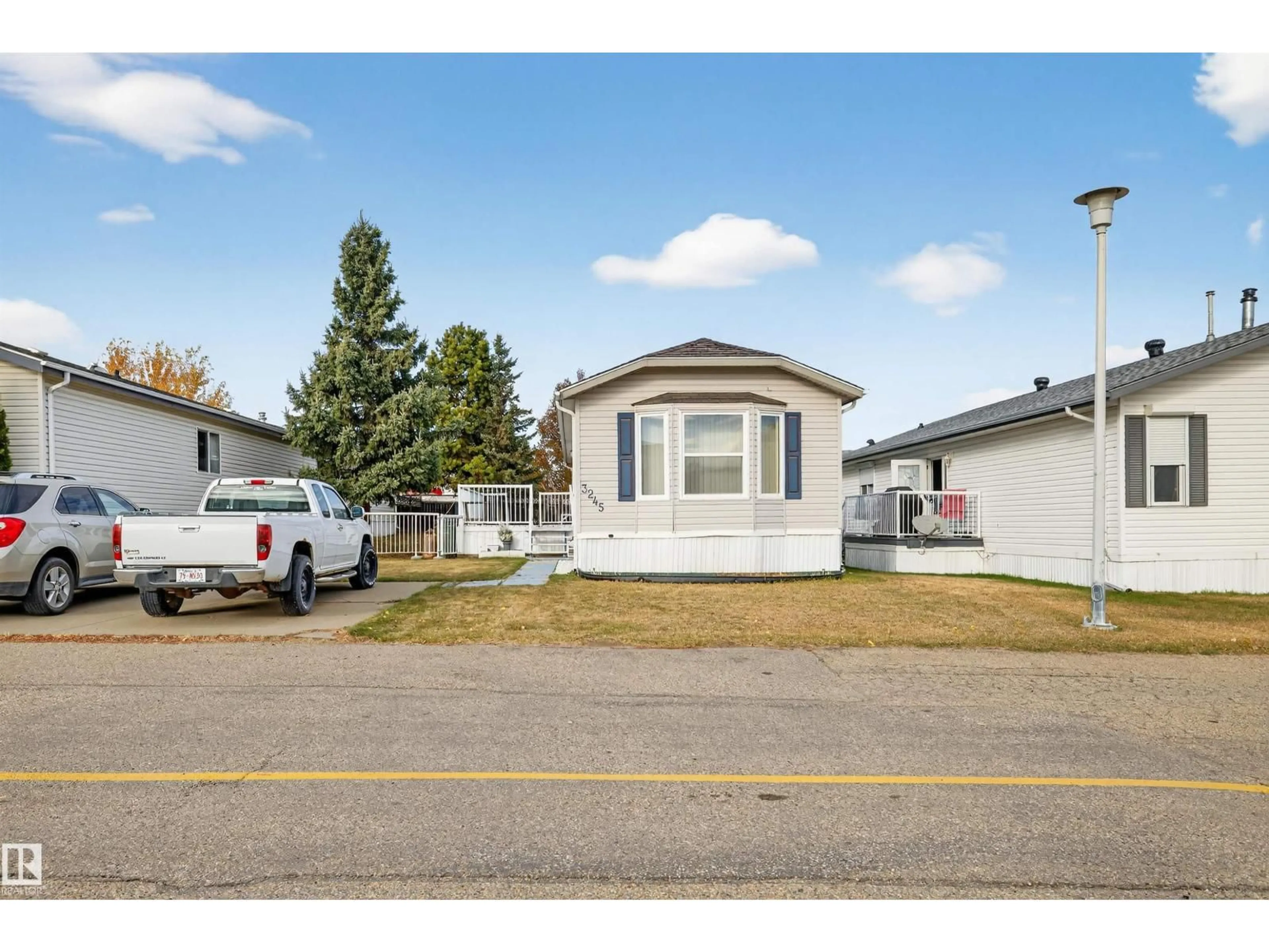 Home with vinyl exterior material, street for 3245 LAKEWOOD CL, Edmonton Alberta T5S2R8