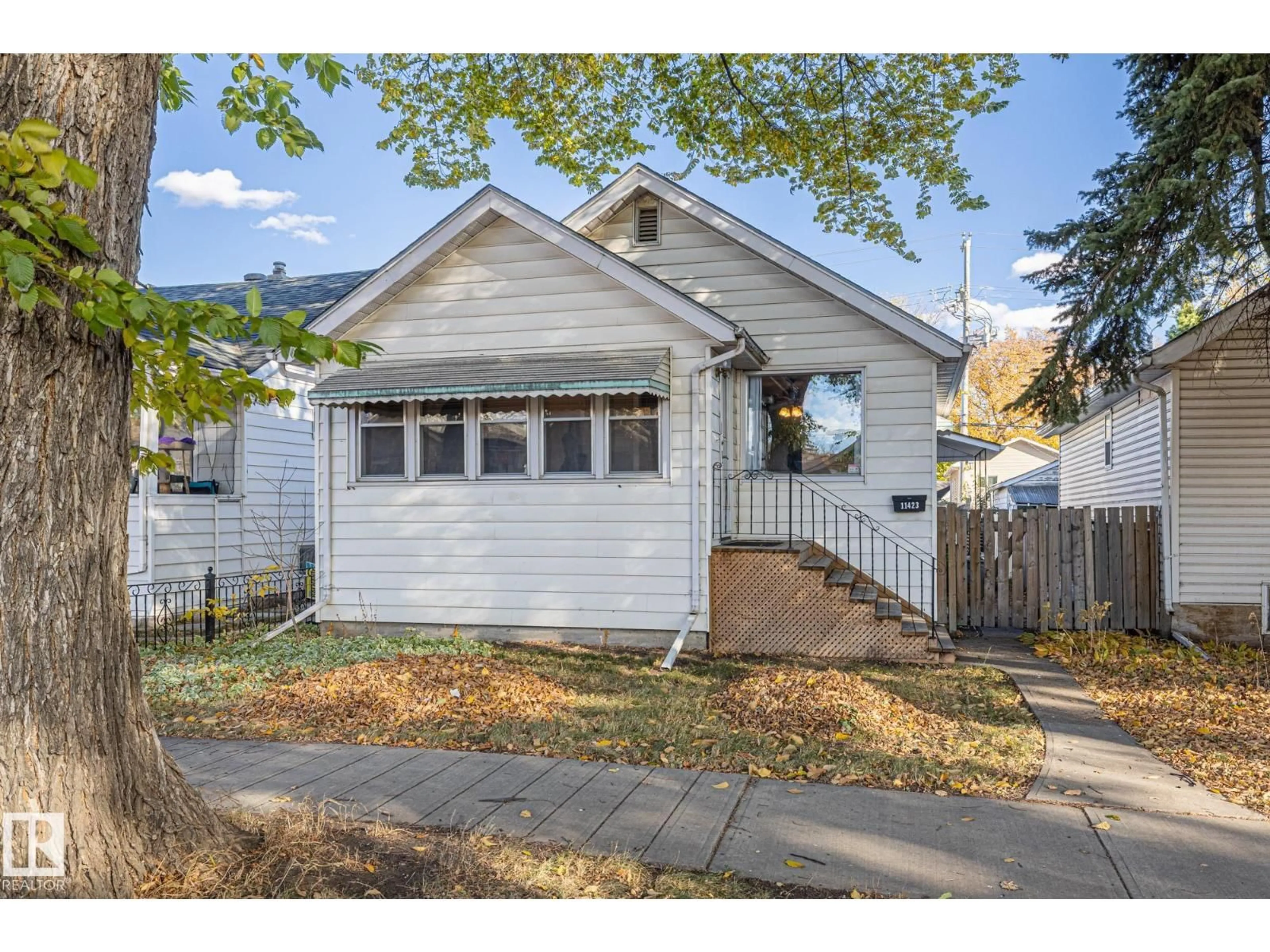 Home with vinyl exterior material, street for 11423 85 ST, Edmonton Alberta T5B3E1