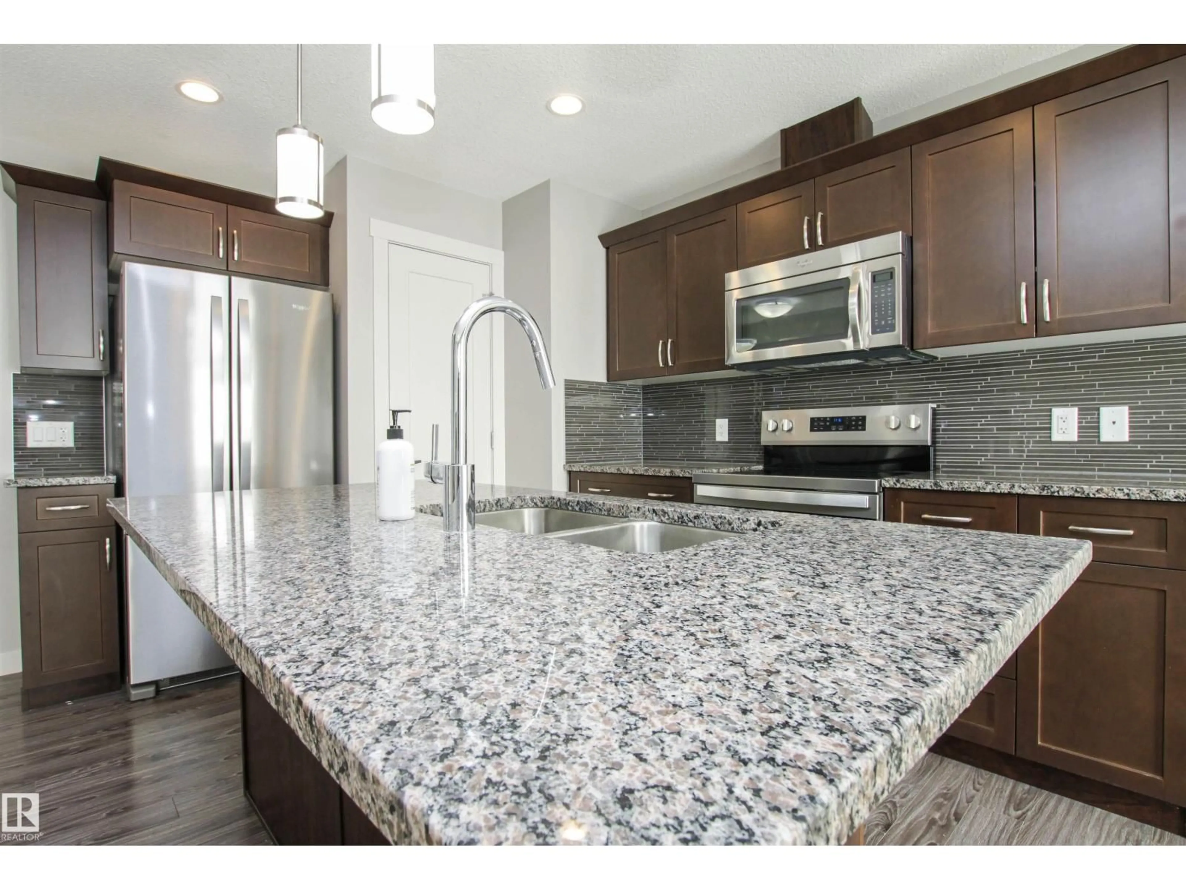 Open concept kitchen, ceramic/tile floor for 125 ABBEY RD, Sherwood Park Alberta T8H0Z2
