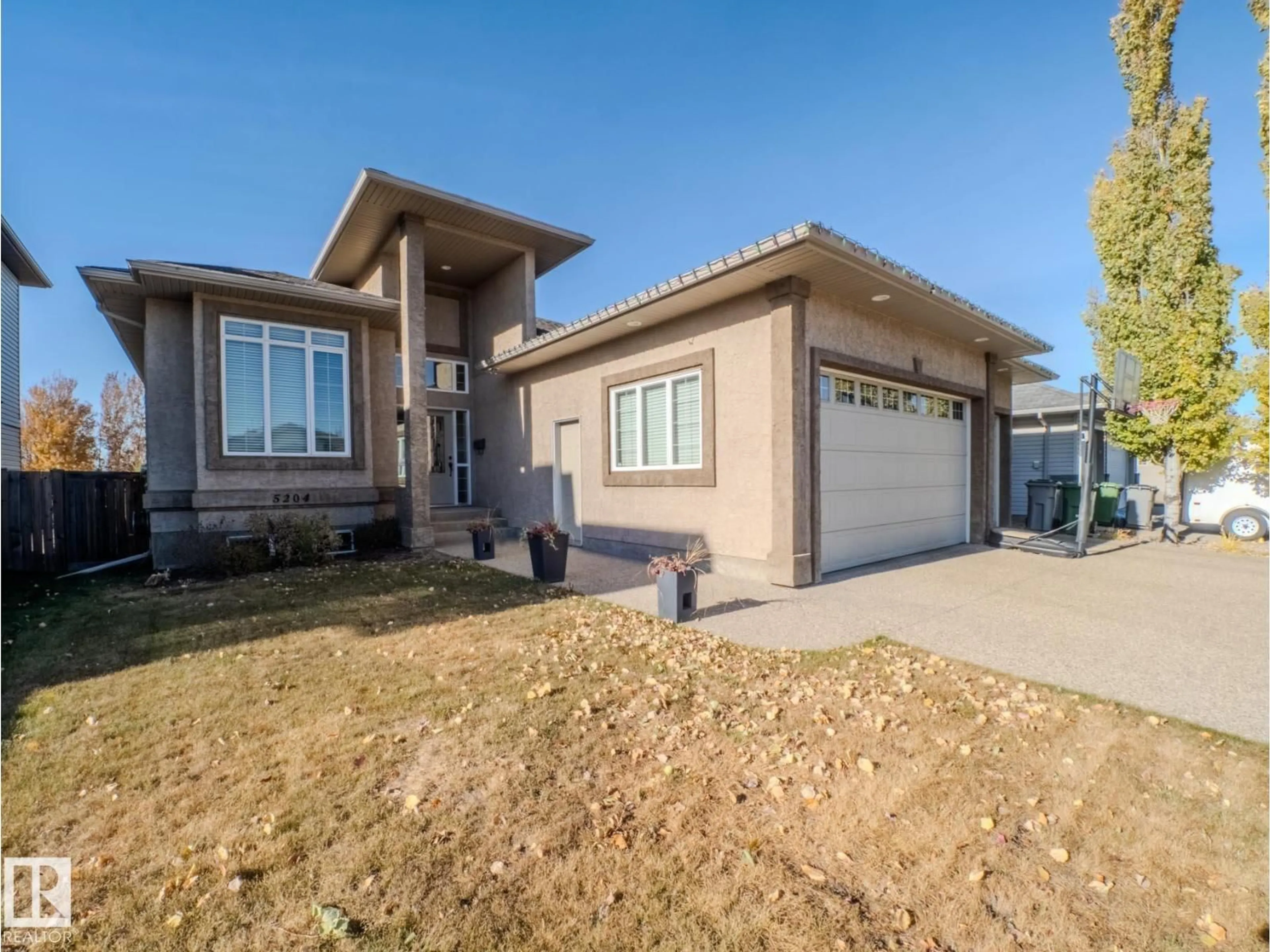 Home with vinyl exterior material, street for 5204 63 ST, Beaumont Alberta T4X1V4