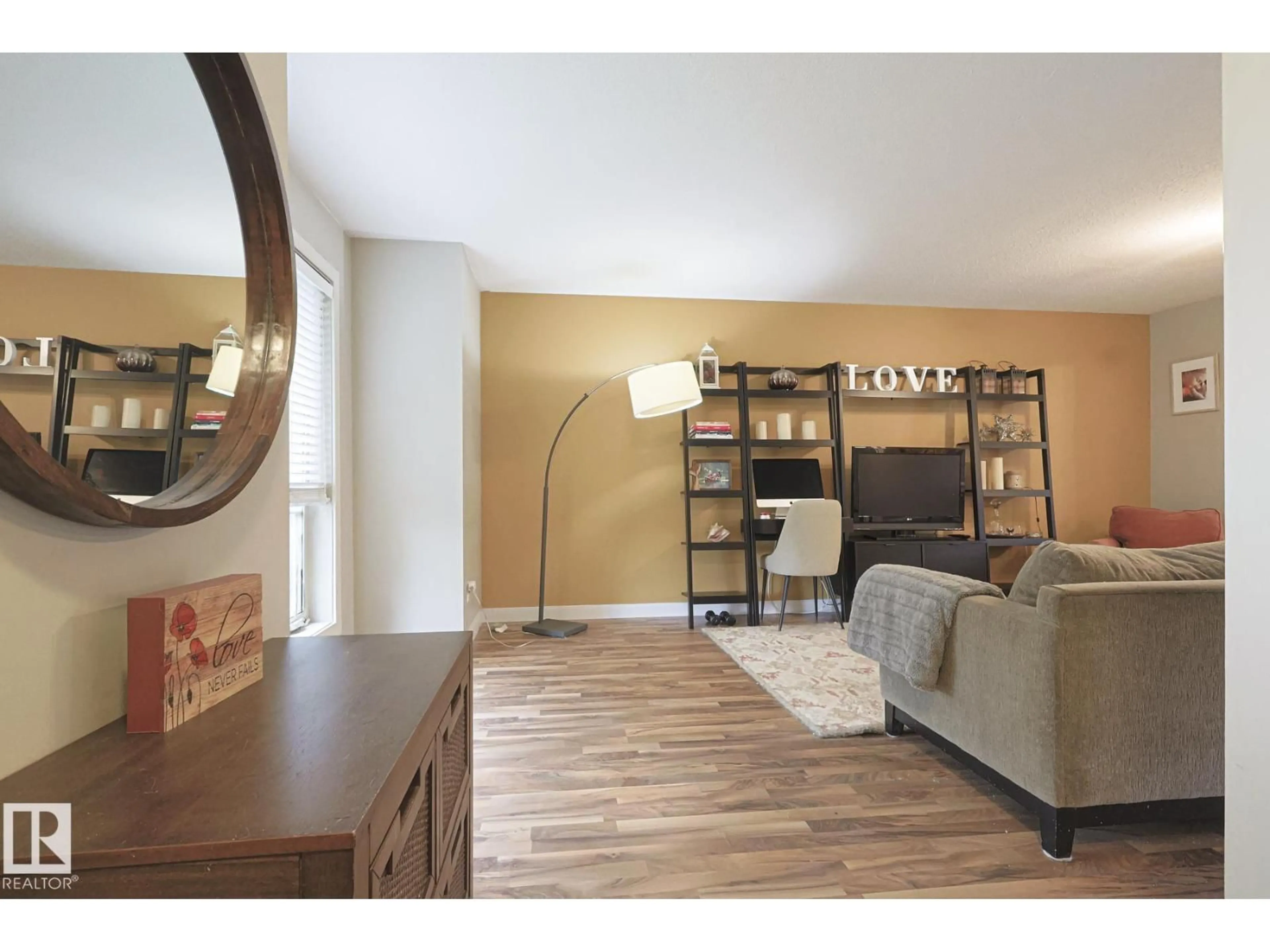 Living room with furniture, wood/laminate floor for 2544 ANDERSON WY, Edmonton Alberta T6W0L1