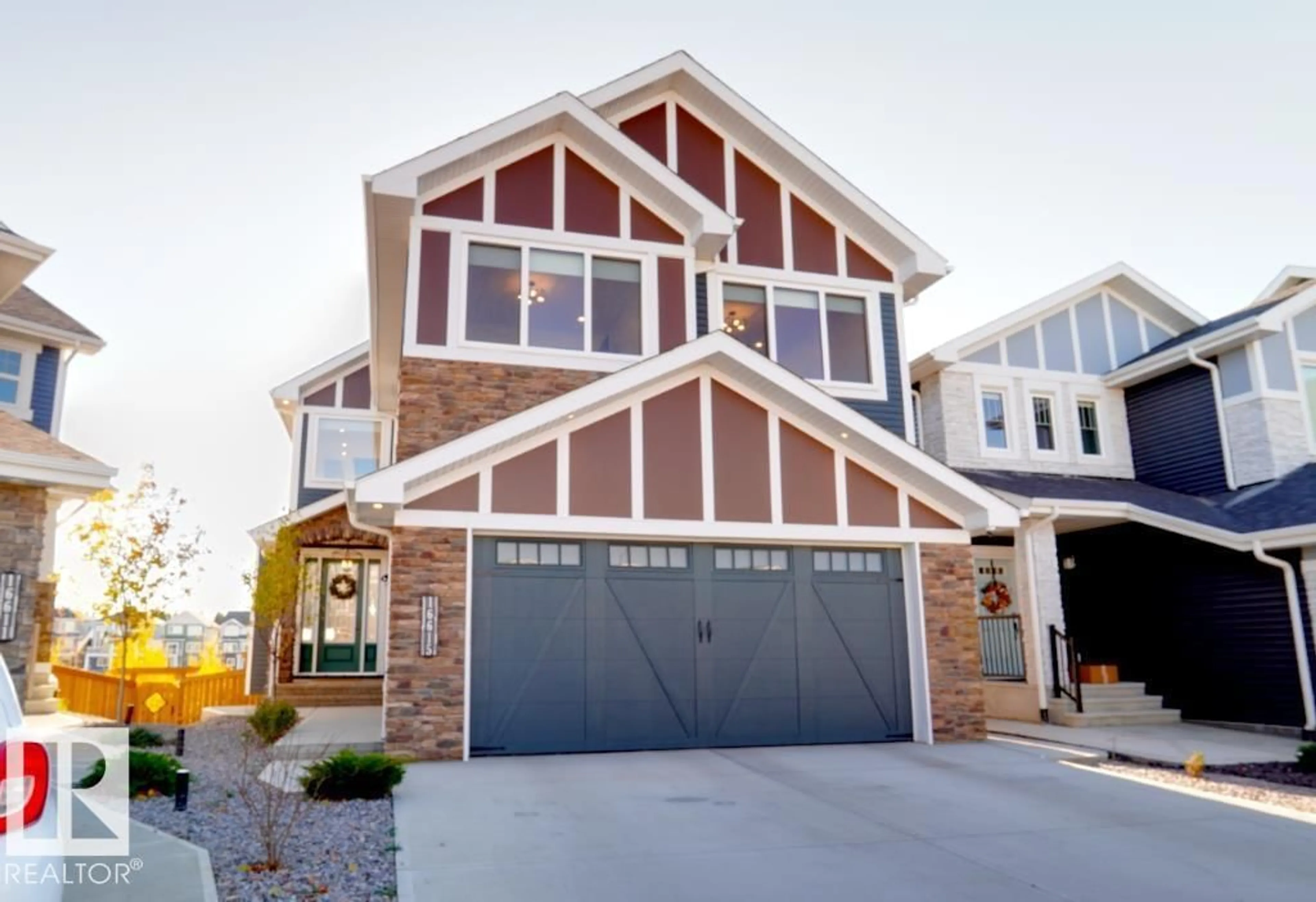 Home with vinyl exterior material, street for 16615 32 AV, Edmonton Alberta T6W4R2