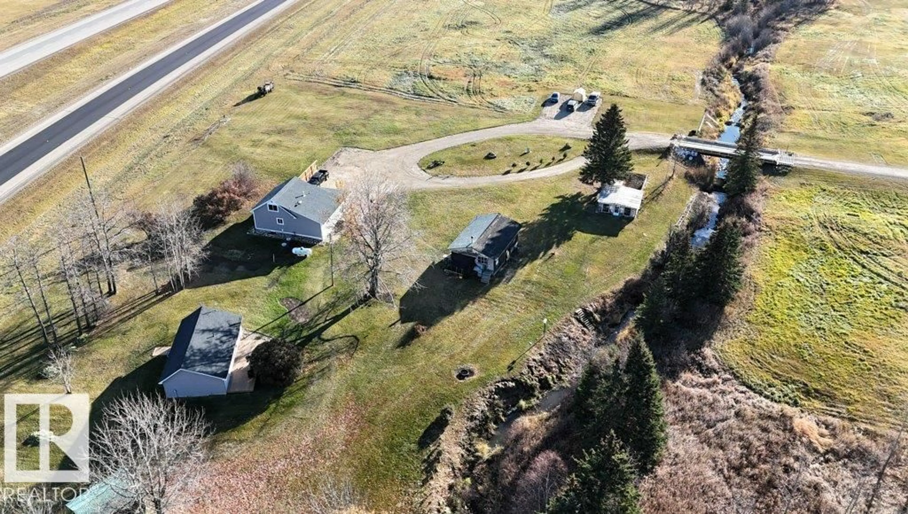 A pic from outside/outdoor area/front of a property/back of a property/a pic from drone, unknown for 101034A TWP ROAD 590, Rural Woodlands County Alberta T7S1S1