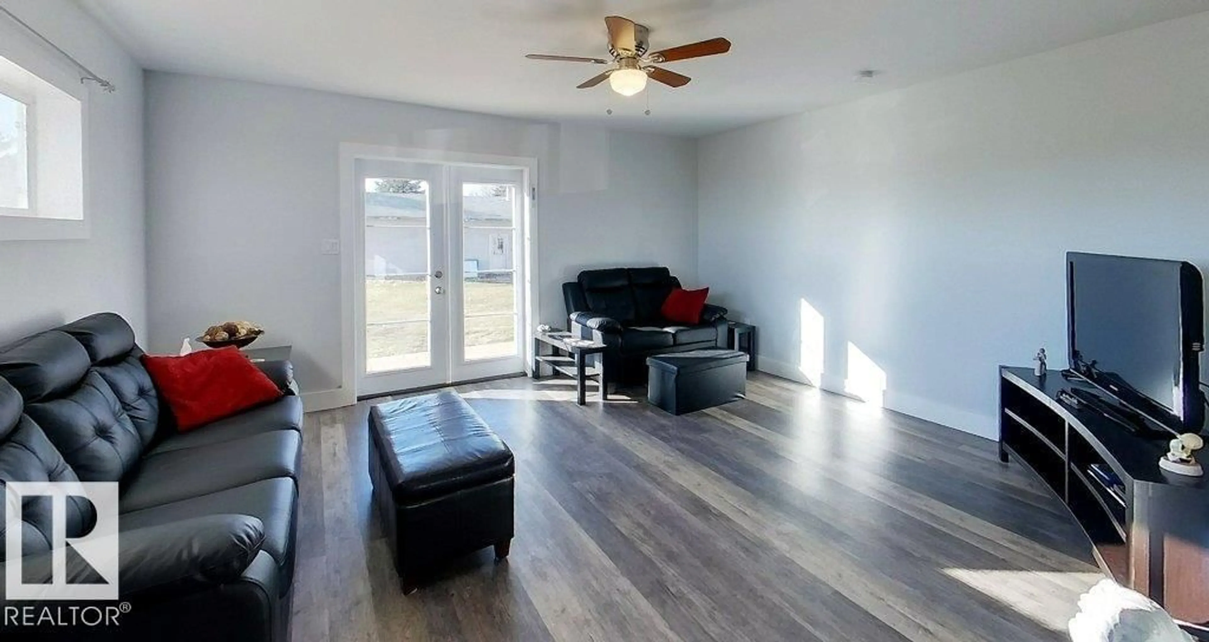 Living room with furniture, wood/laminate floor for 101034A TWP ROAD 590, Rural Woodlands County Alberta T7S1S1