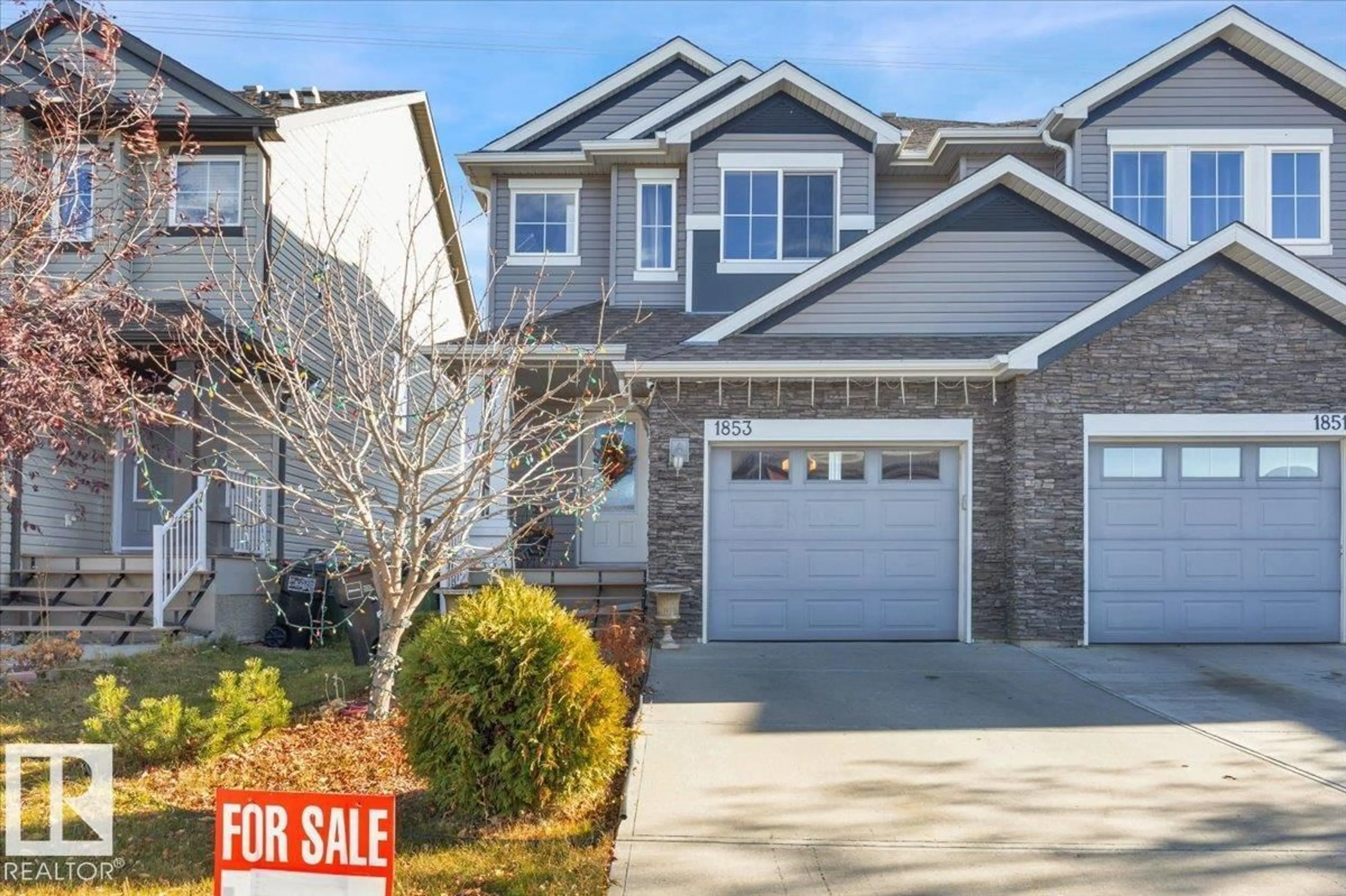 Home with vinyl exterior material, street for NW - 1853 28 ST, Edmonton Alberta T6T0N5