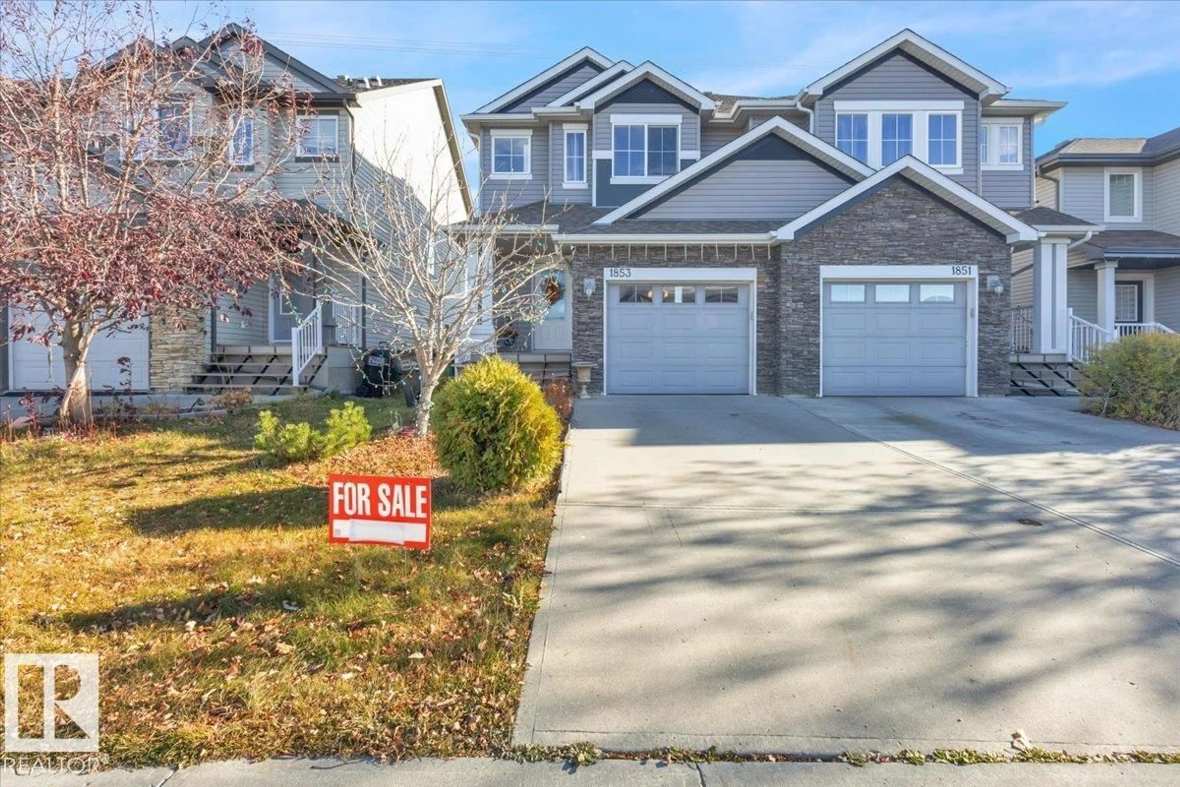 Home with vinyl exterior material, street for NW - 1853 28 ST, Edmonton Alberta T6T0N5