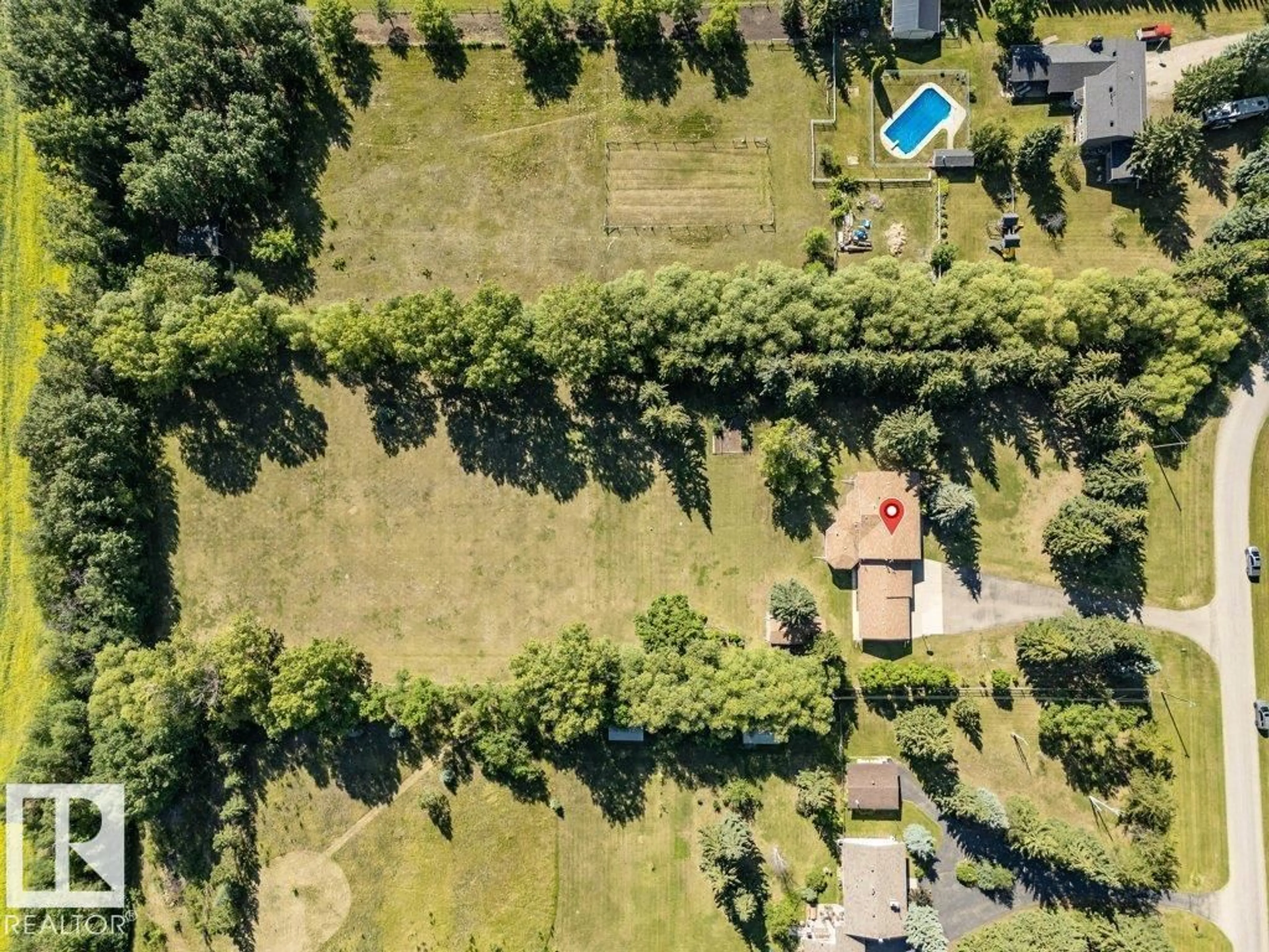 A pic from outside/outdoor area/front of a property/back of a property/a pic from drone, unknown for 23 - 51514 RGE RD 261, Rural Parkland County Alberta T7Y1B3