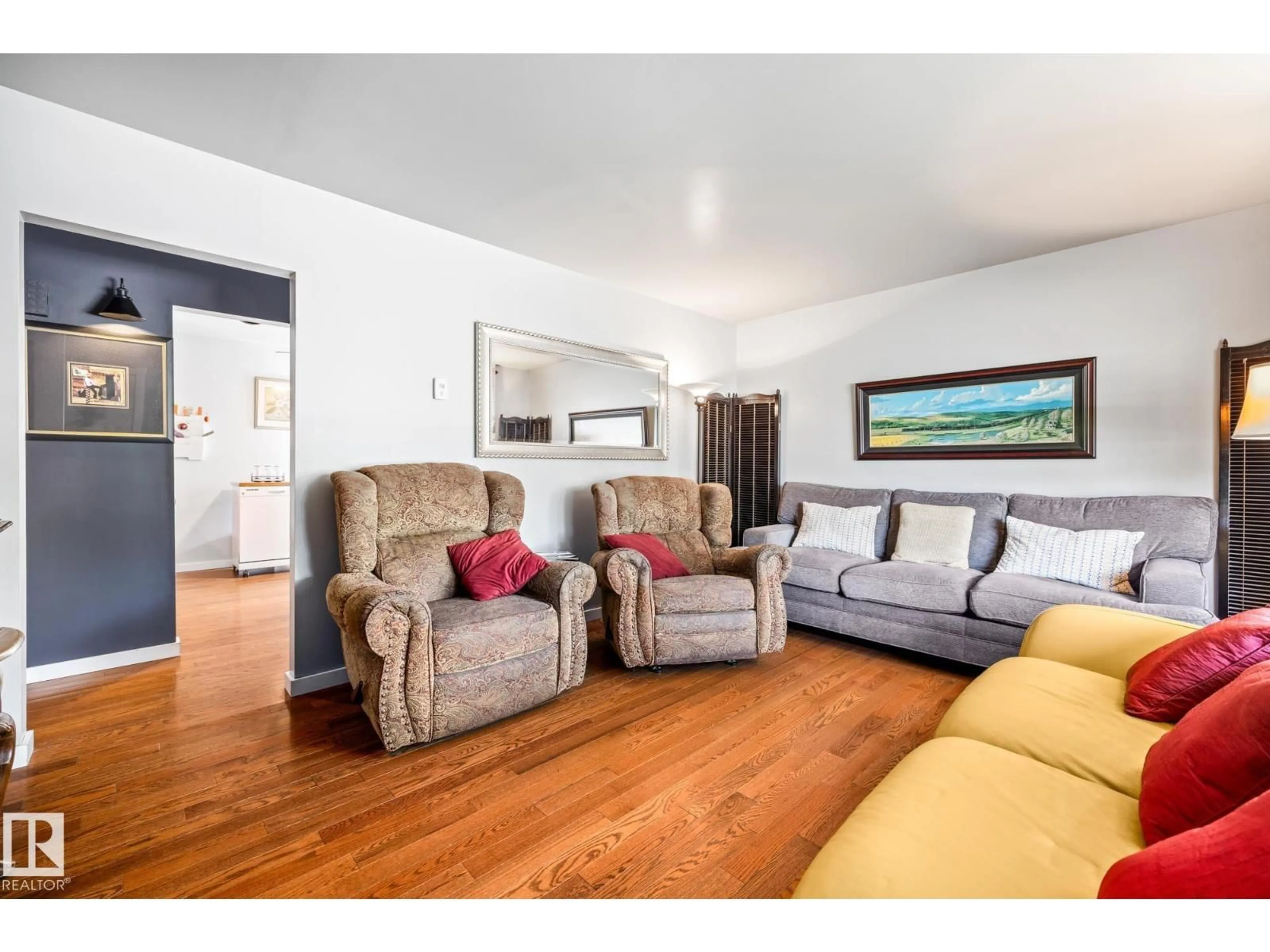 Living room with furniture, wood/laminate floor for NW - 9135 155 ST, Edmonton Alberta T5R1W6