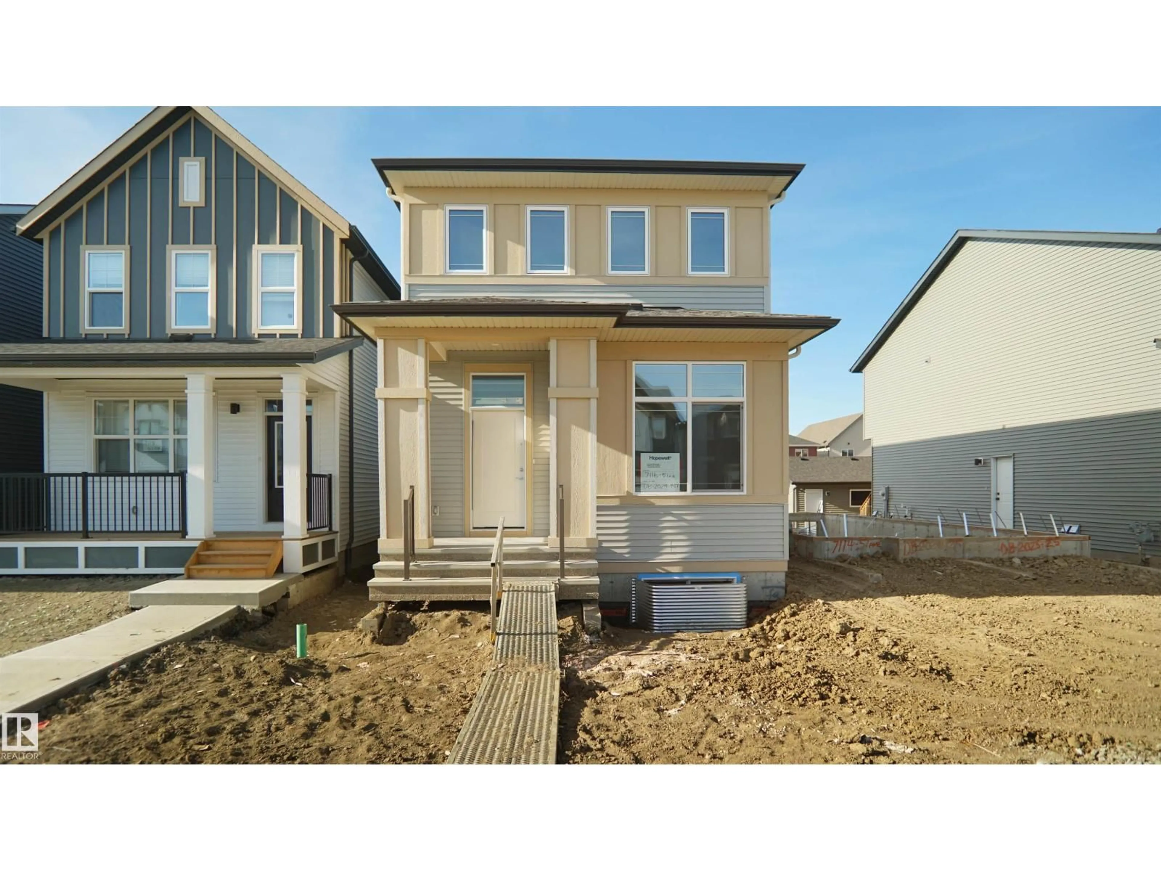 Home with vinyl exterior material, street for 7116 51 AV, Beaumont Alberta T4X3E6
