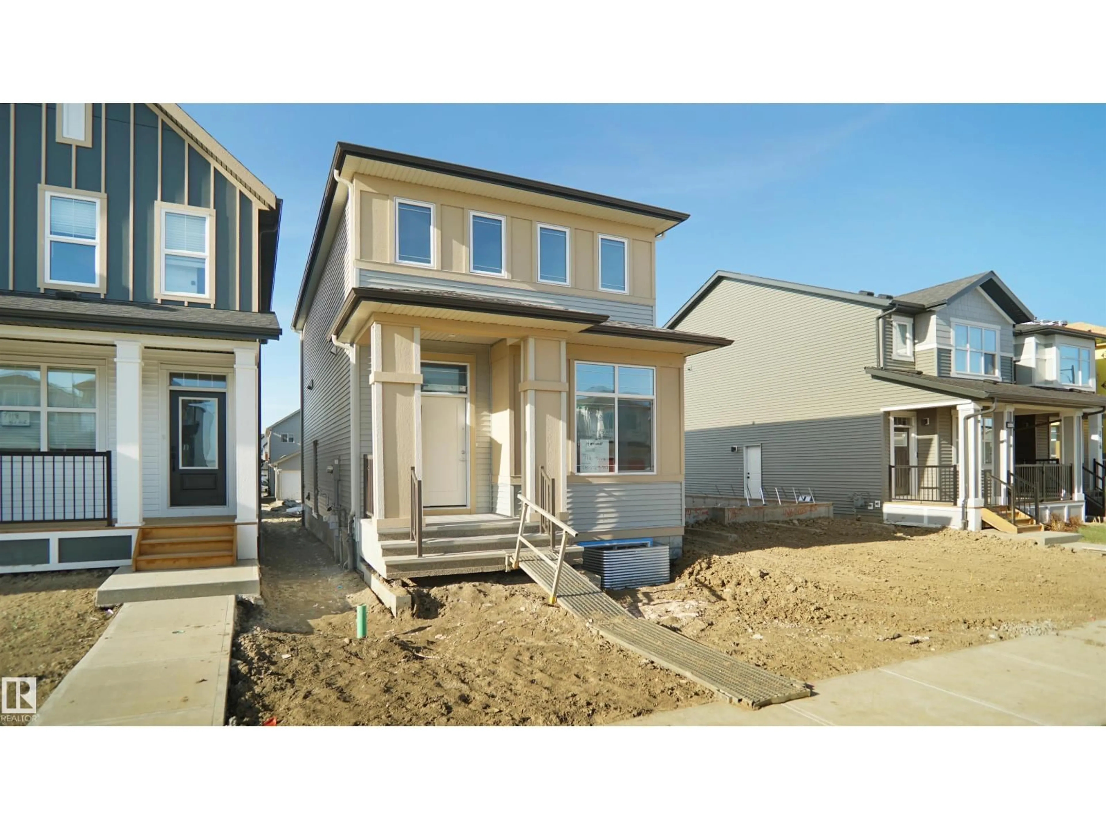 Home with vinyl exterior material, street for 7116 51 AV, Beaumont Alberta T4X3E6