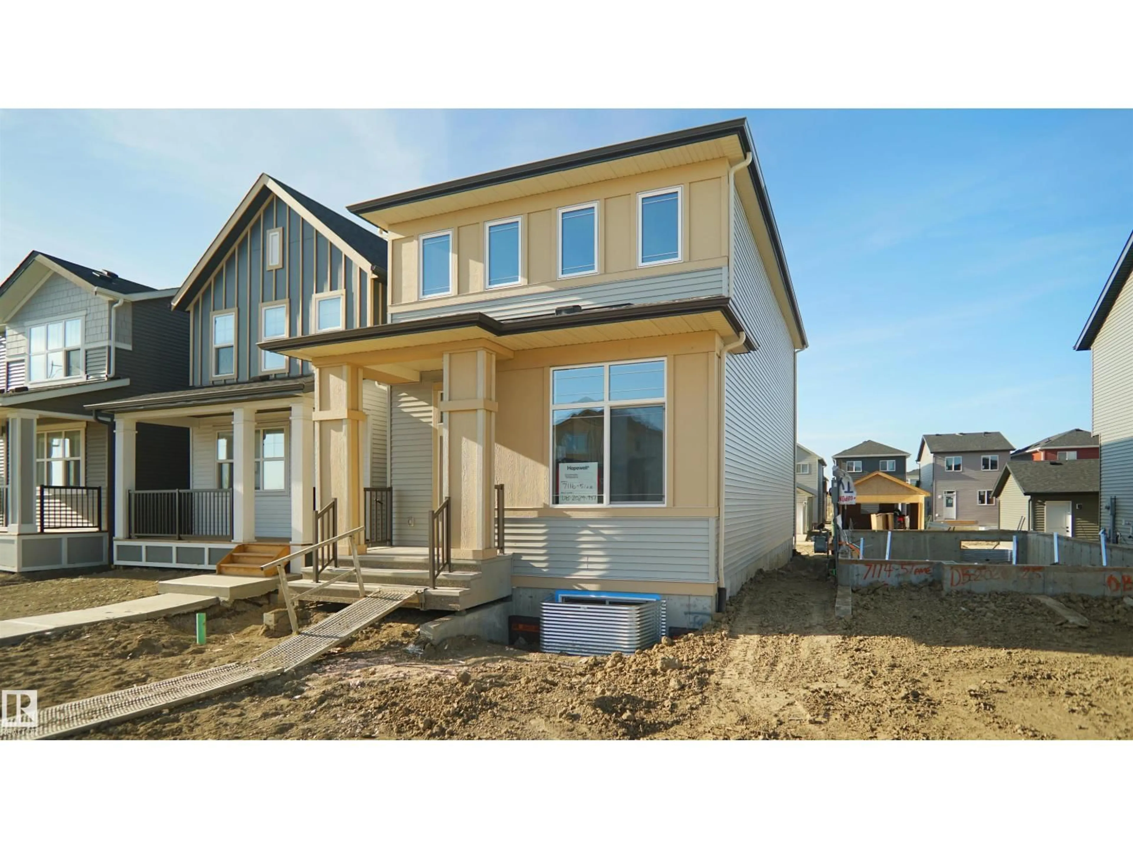 Home with vinyl exterior material, street for 7116 51 AV, Beaumont Alberta T4X3E6