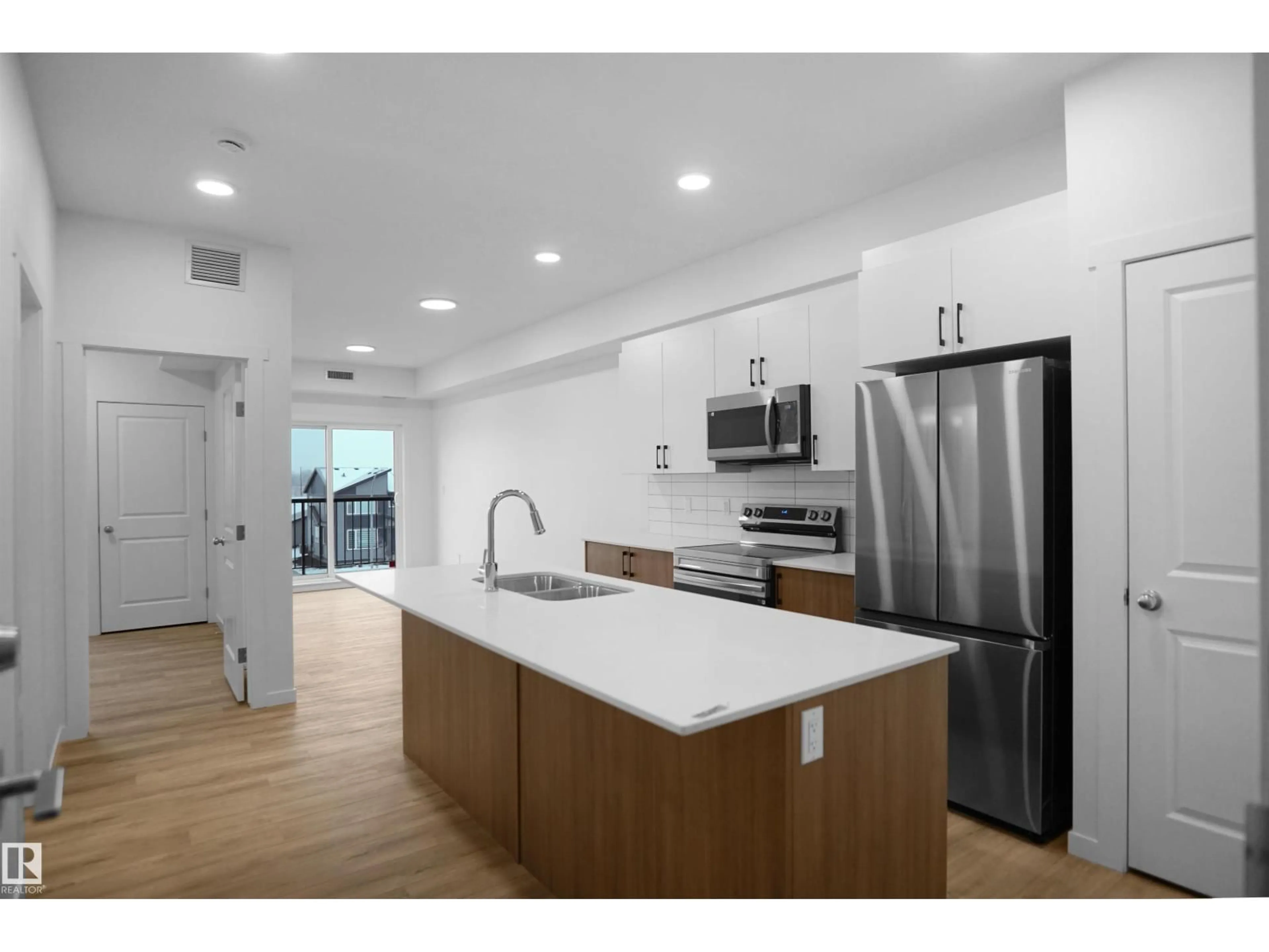 Open concept kitchen, unknown for #102 - 3715 141 ST, Edmonton Alberta T6W5M9