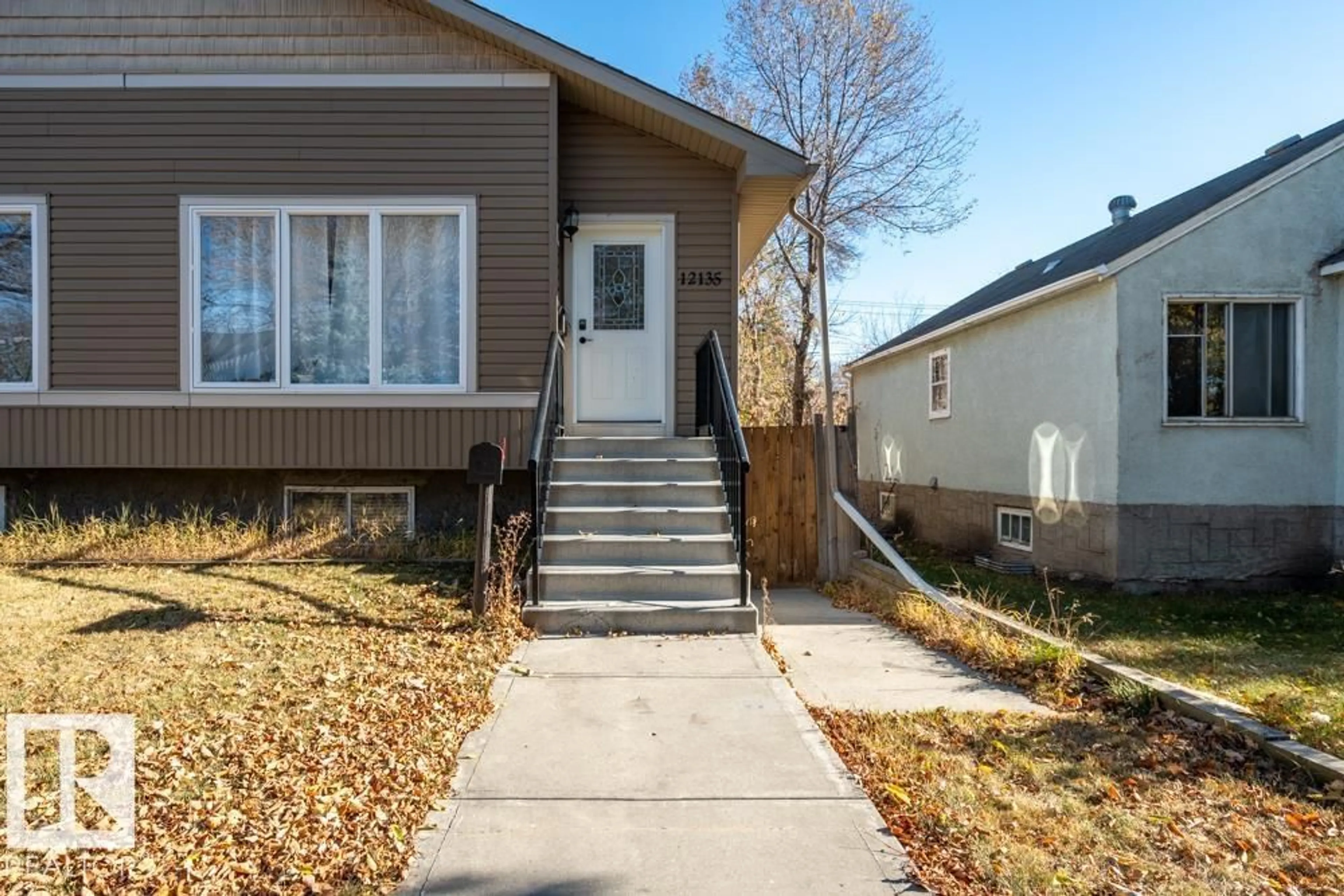 Home with vinyl exterior material, street for NW - 12135 & 12137 124 ST, Edmonton Alberta T5N0N1