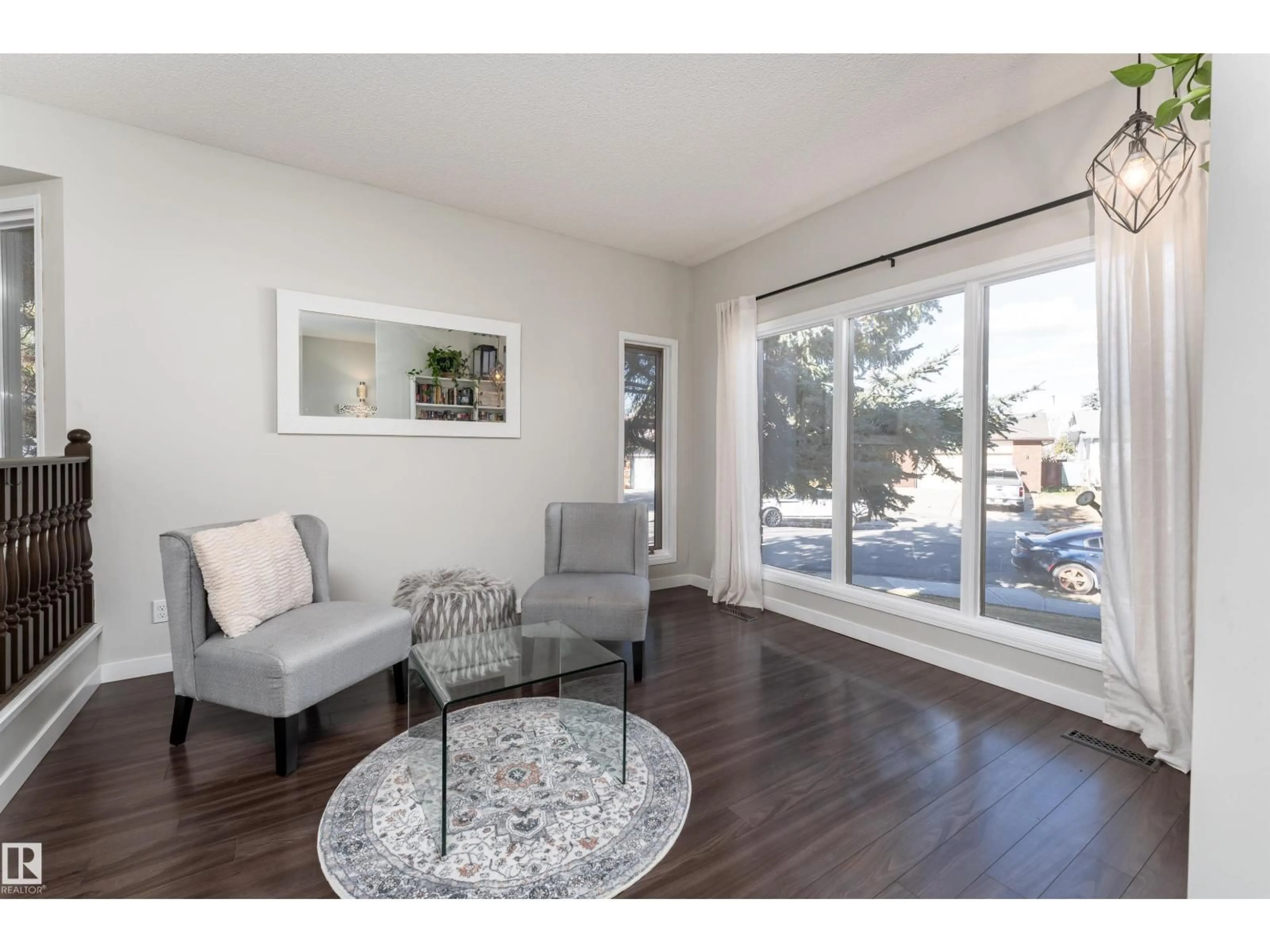 Living room with furniture, wood/laminate floor for 47 COACHMAN WY, Sherwood Park Alberta T8H1C2