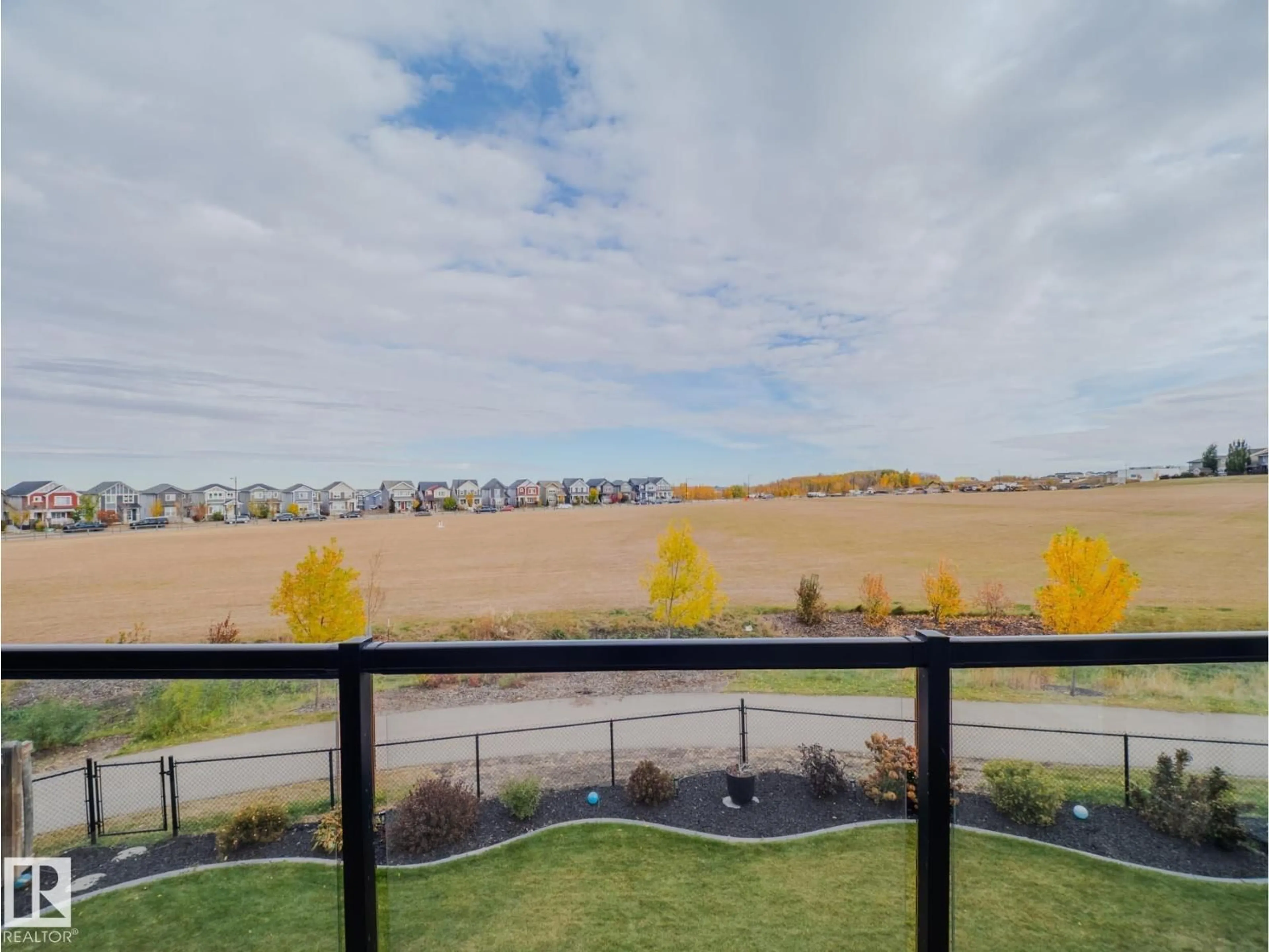 A pic from outside/outdoor area/front of a property/back of a property/a pic from drone, water/lake/river/ocean view for LI NW - 1049 COOPERS HAWK LINK, Edmonton Alberta T5S0M2