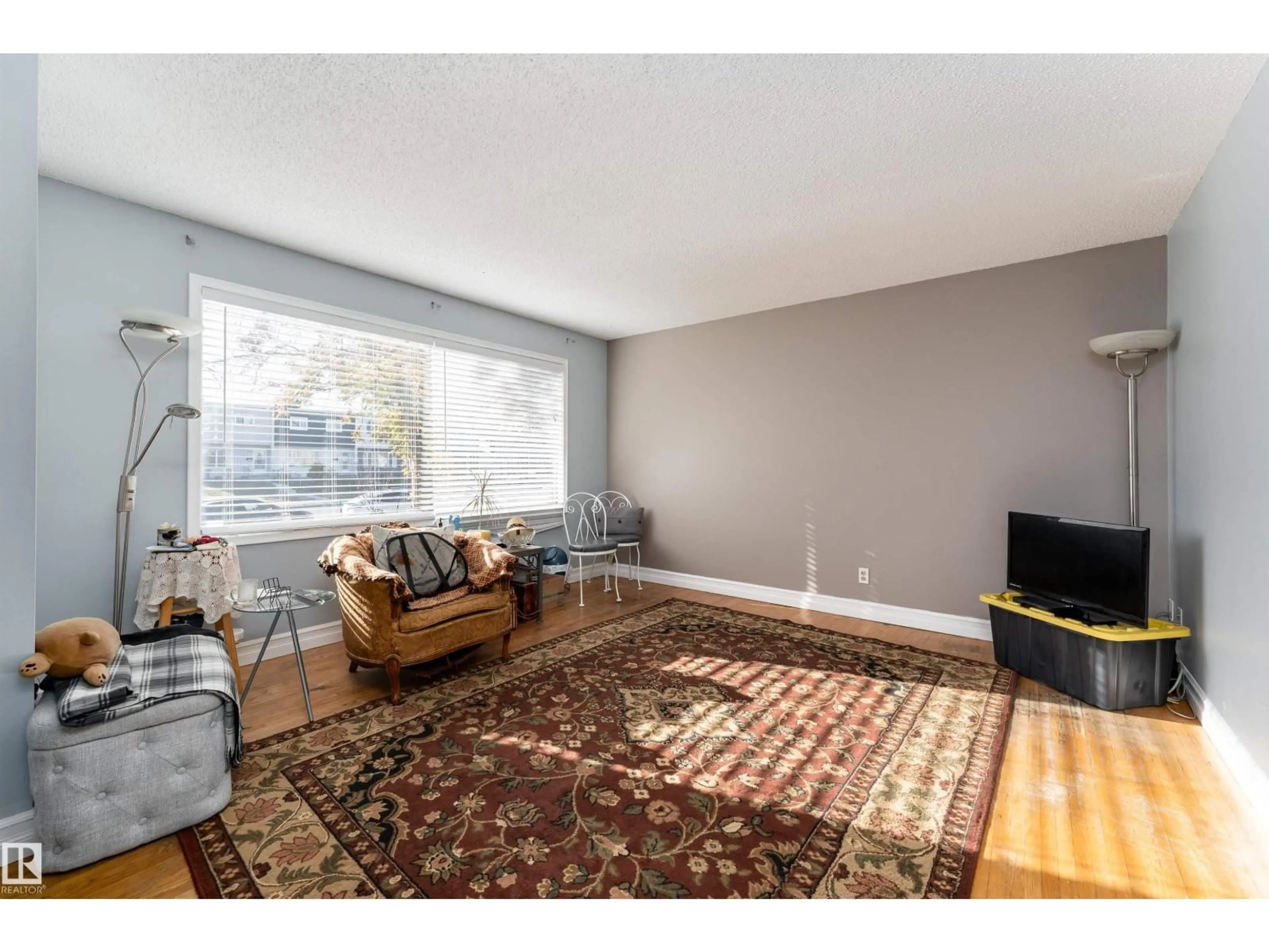 Living room with furniture, unknown for 10314 132 AV, Edmonton Alberta T5E0Z1