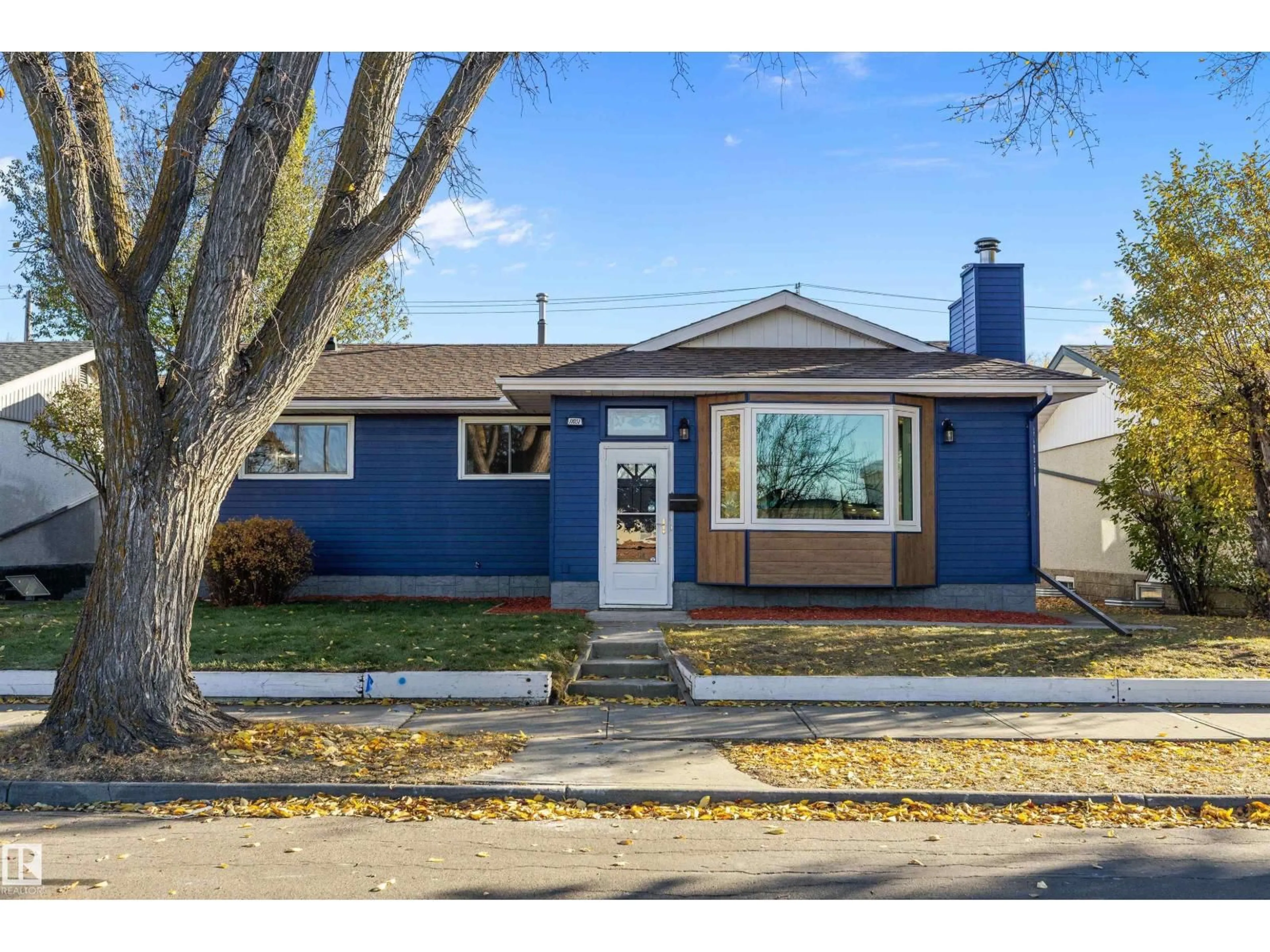 Home with vinyl exterior material, street for NW - 11031 153A ST, Edmonton Alberta T5P2E7