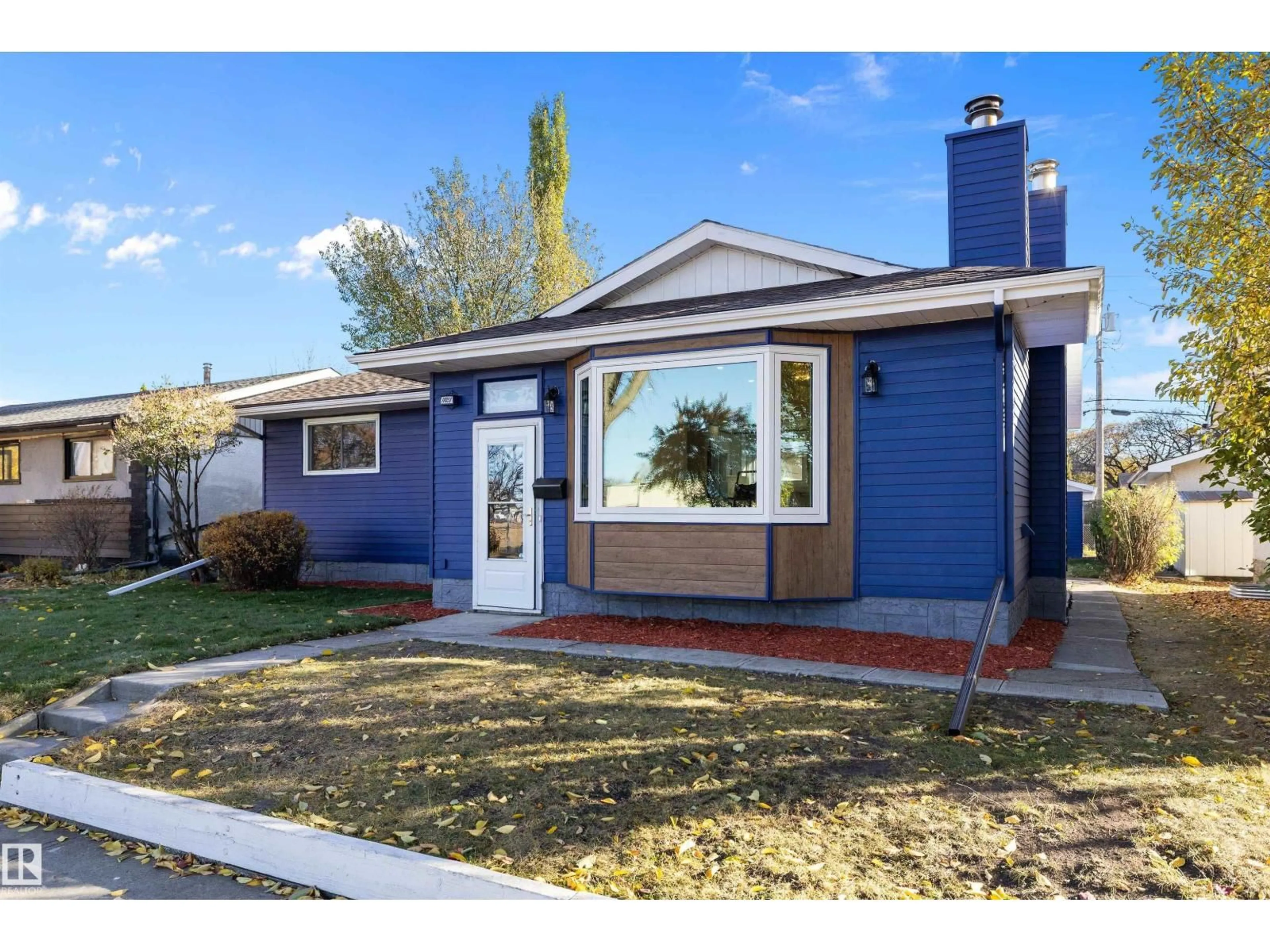 Home with vinyl exterior material, street for NW - 11031 153A ST, Edmonton Alberta T5P2E7
