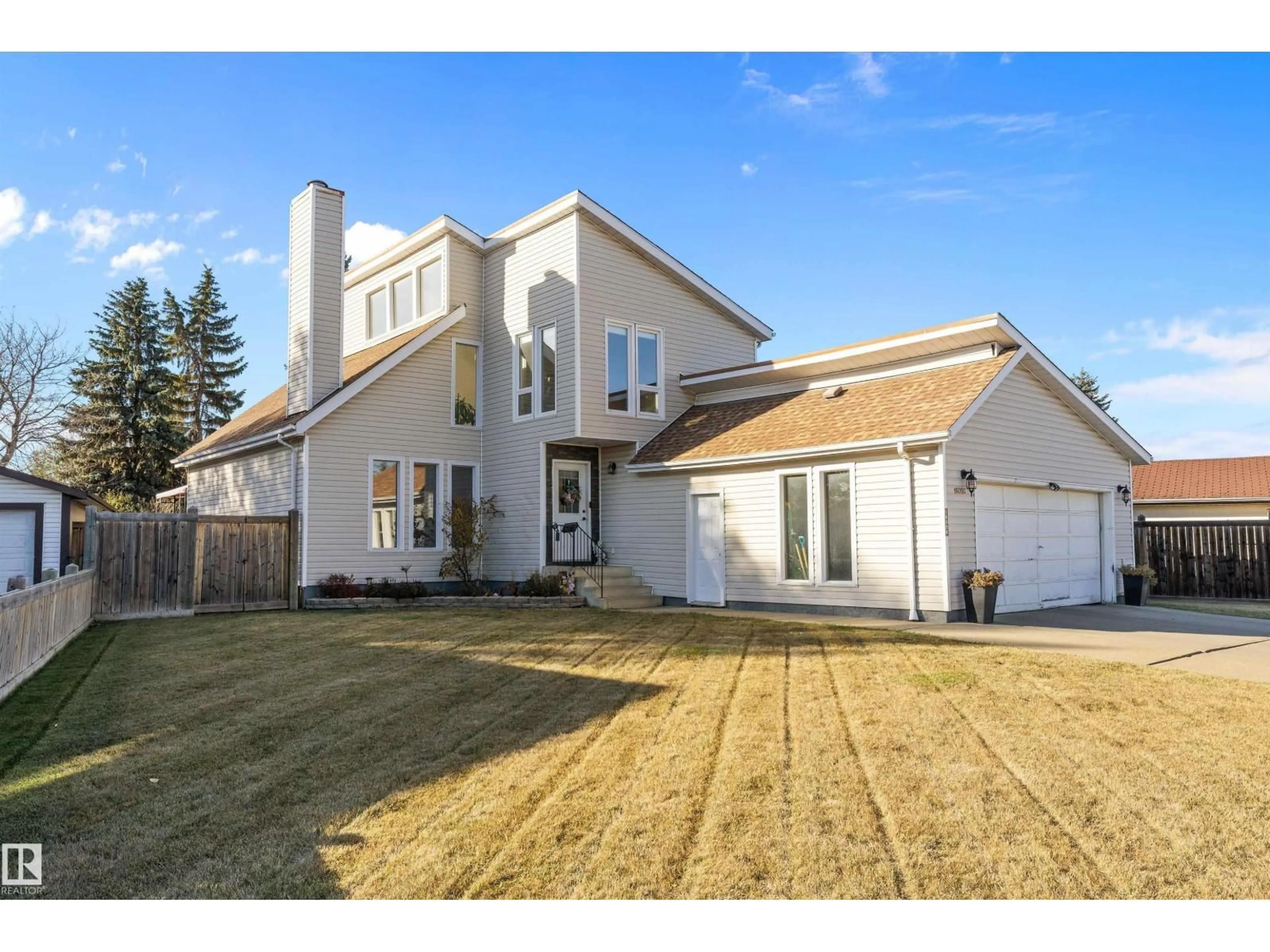Home with vinyl exterior material, street for 16056 123 ST, Edmonton Alberta T5X2W5