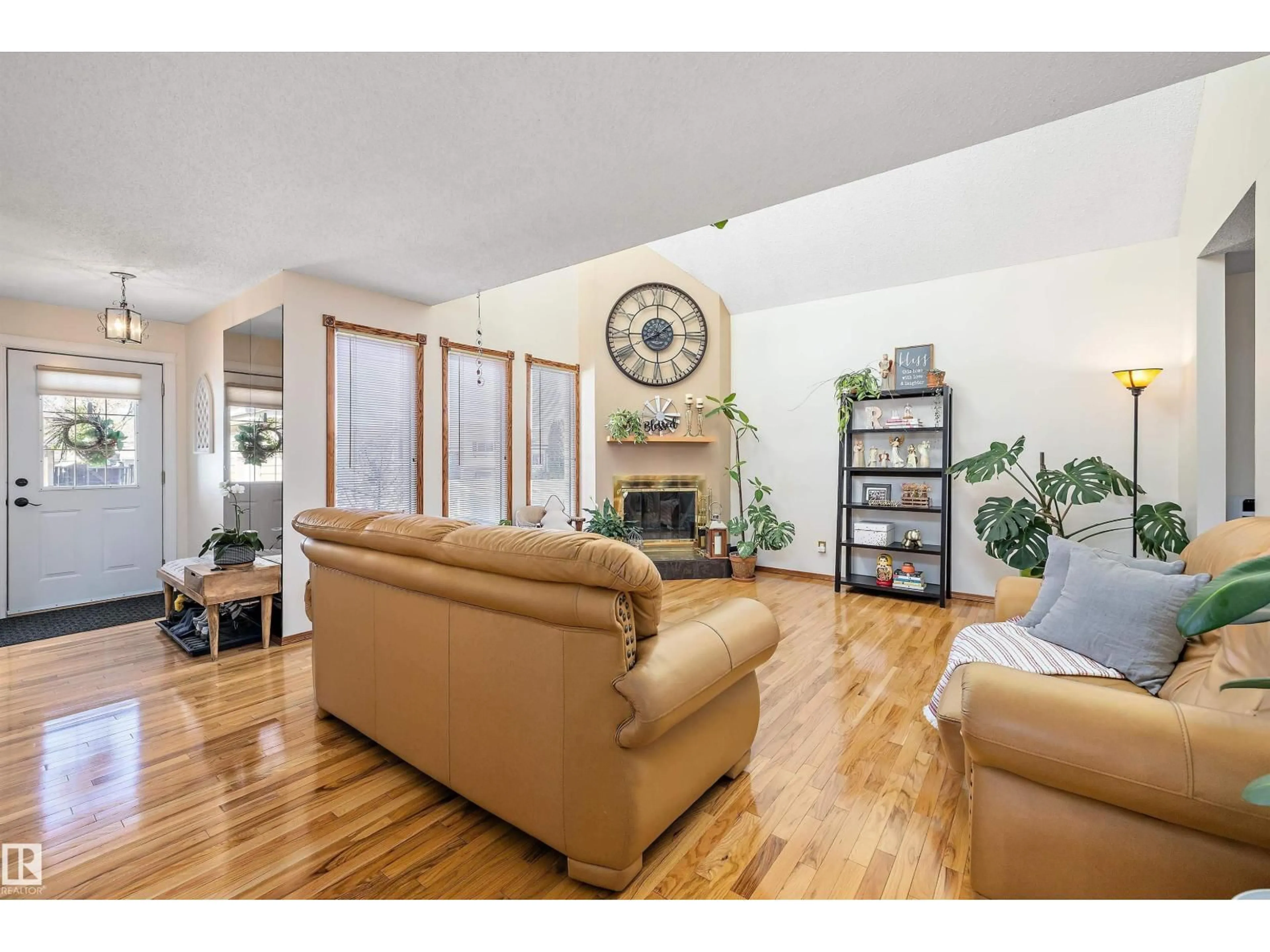 Living room with furniture, wood/laminate floor for 16056 123 ST, Edmonton Alberta T5X2W5
