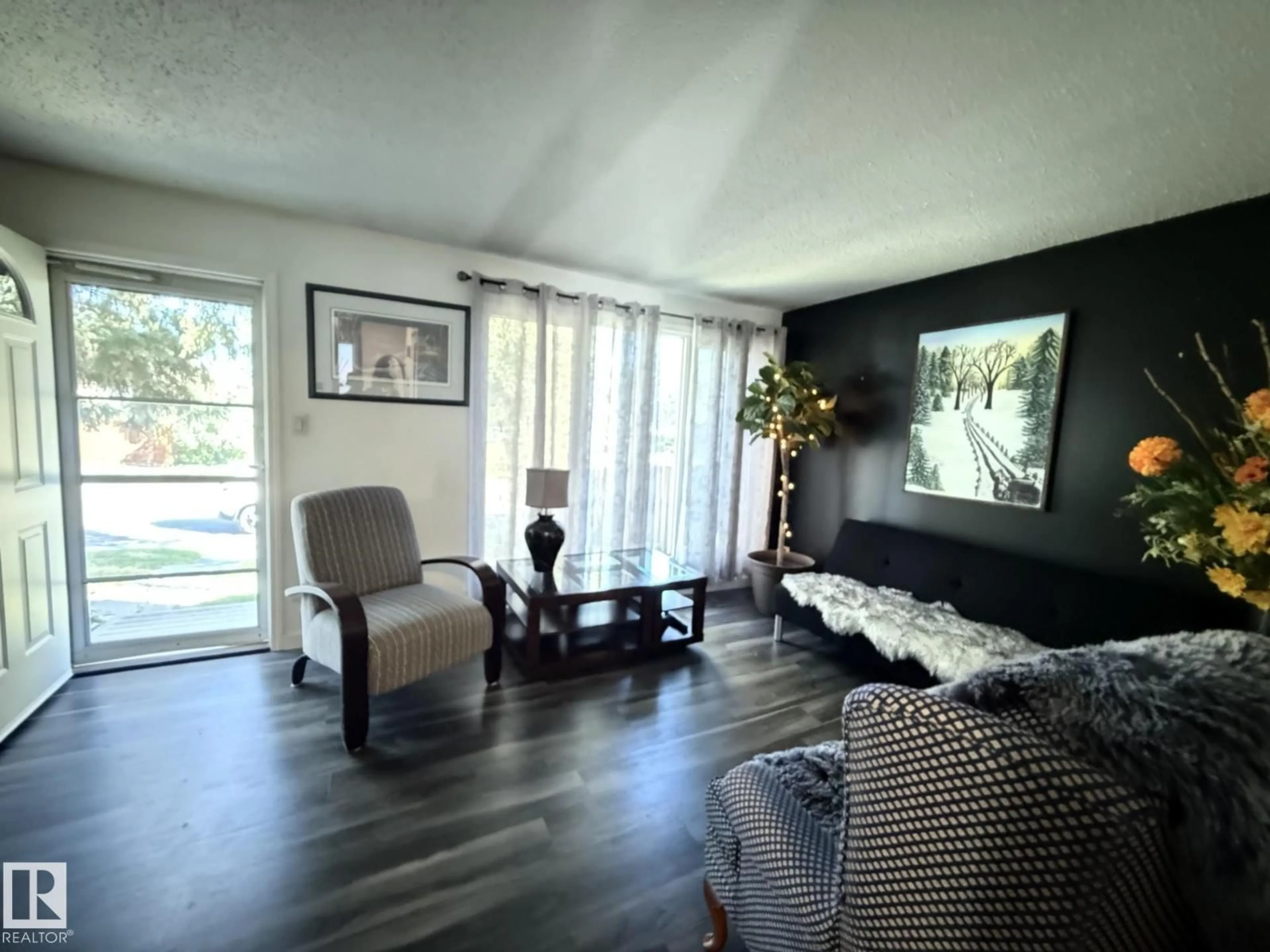 Living room with furniture, wood/laminate floor for 3127 109 ST, Edmonton Alberta T6J3E6