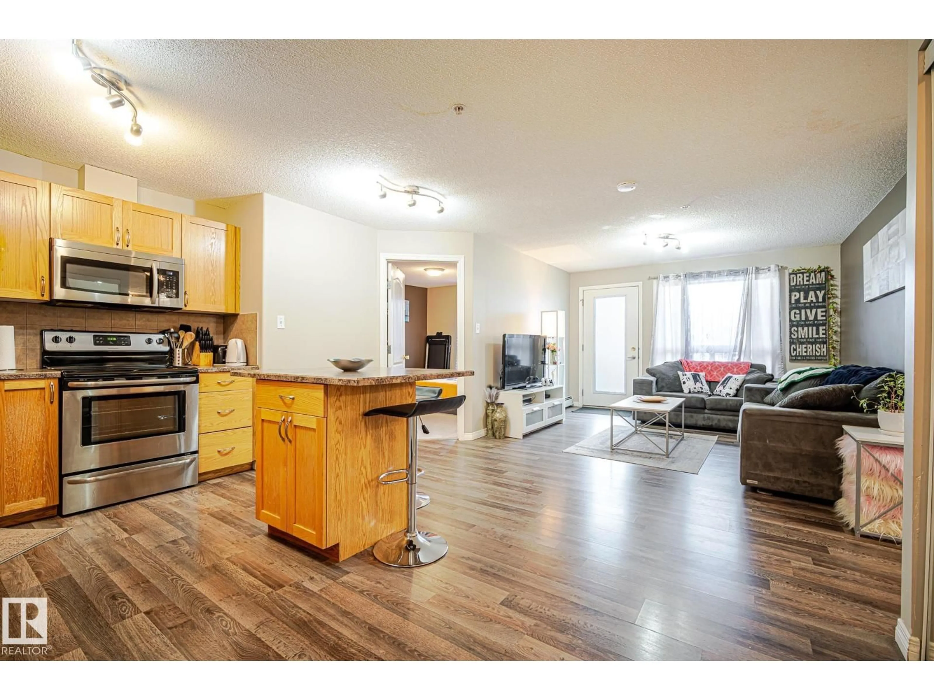 Open concept kitchen, wood/laminate floor for 1124 CLAREVIEW STATION DR, Edmonton Alberta T5Y0E6