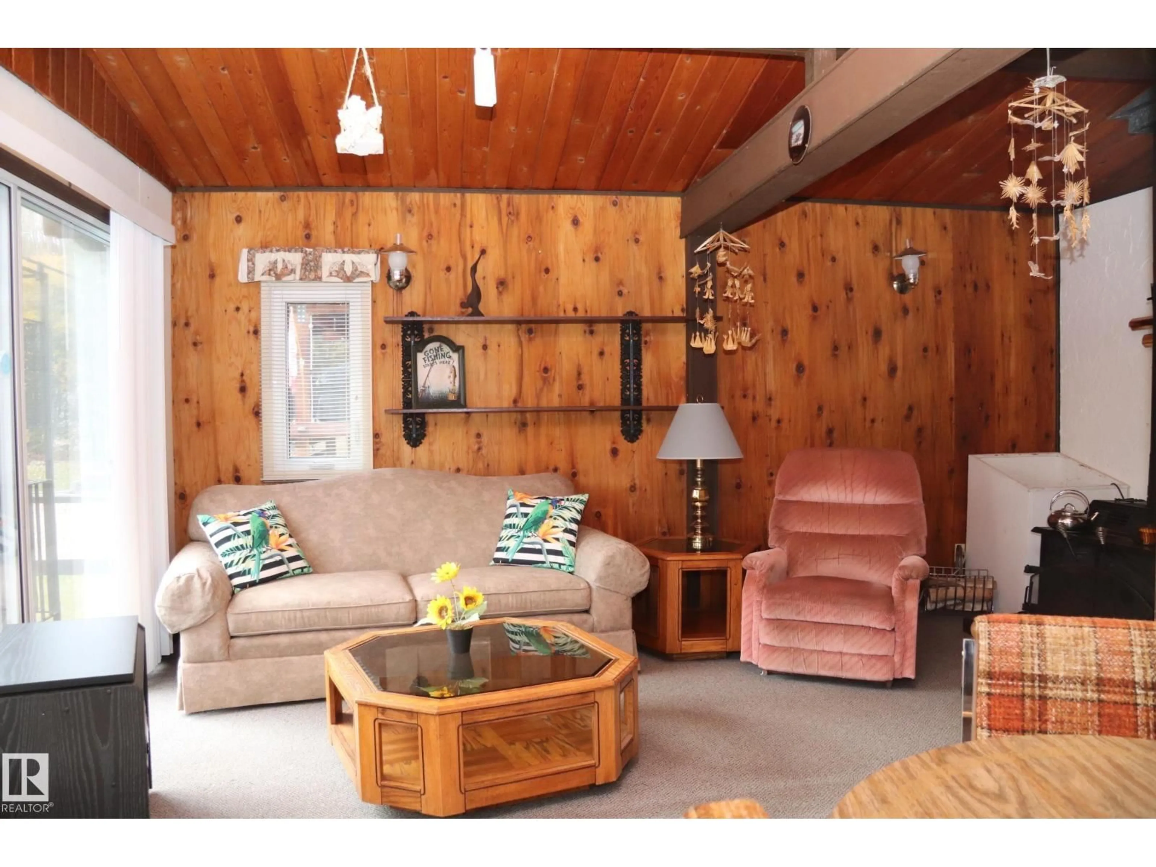 Living room with furniture, wood/laminate floor for 603 LONG LAKE DR, Long Lake Alberta T6A0M0