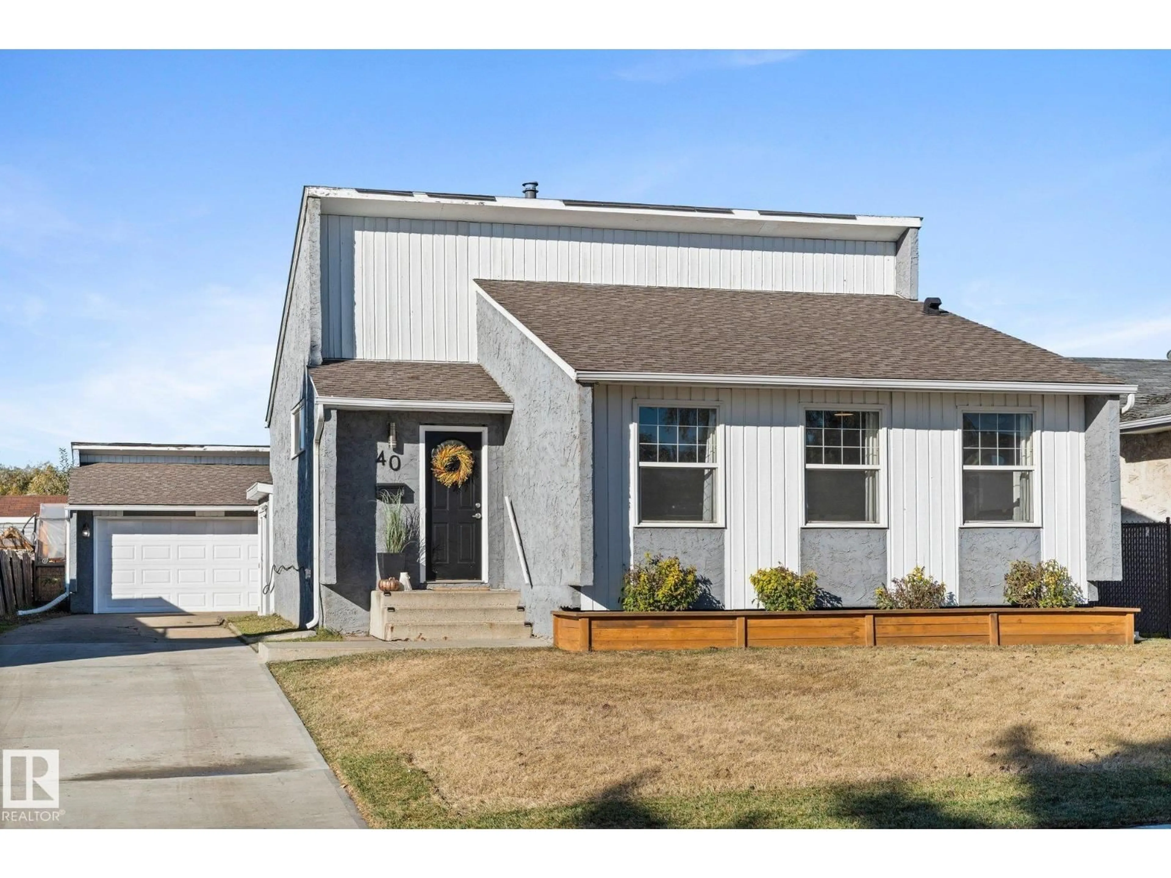 Home with vinyl exterior material, street for 40 HUGHES RD, Edmonton Alberta T5A4E2