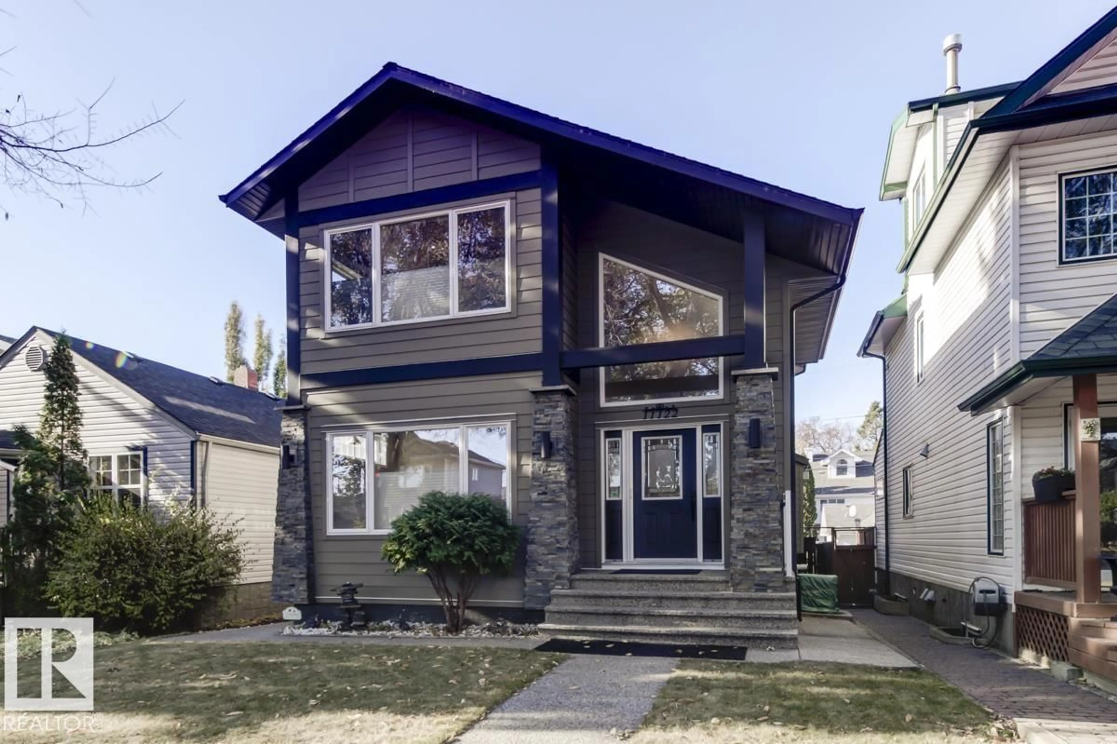 Home with vinyl exterior material, street for 11122 52 ST, Edmonton Alberta T5W3B7