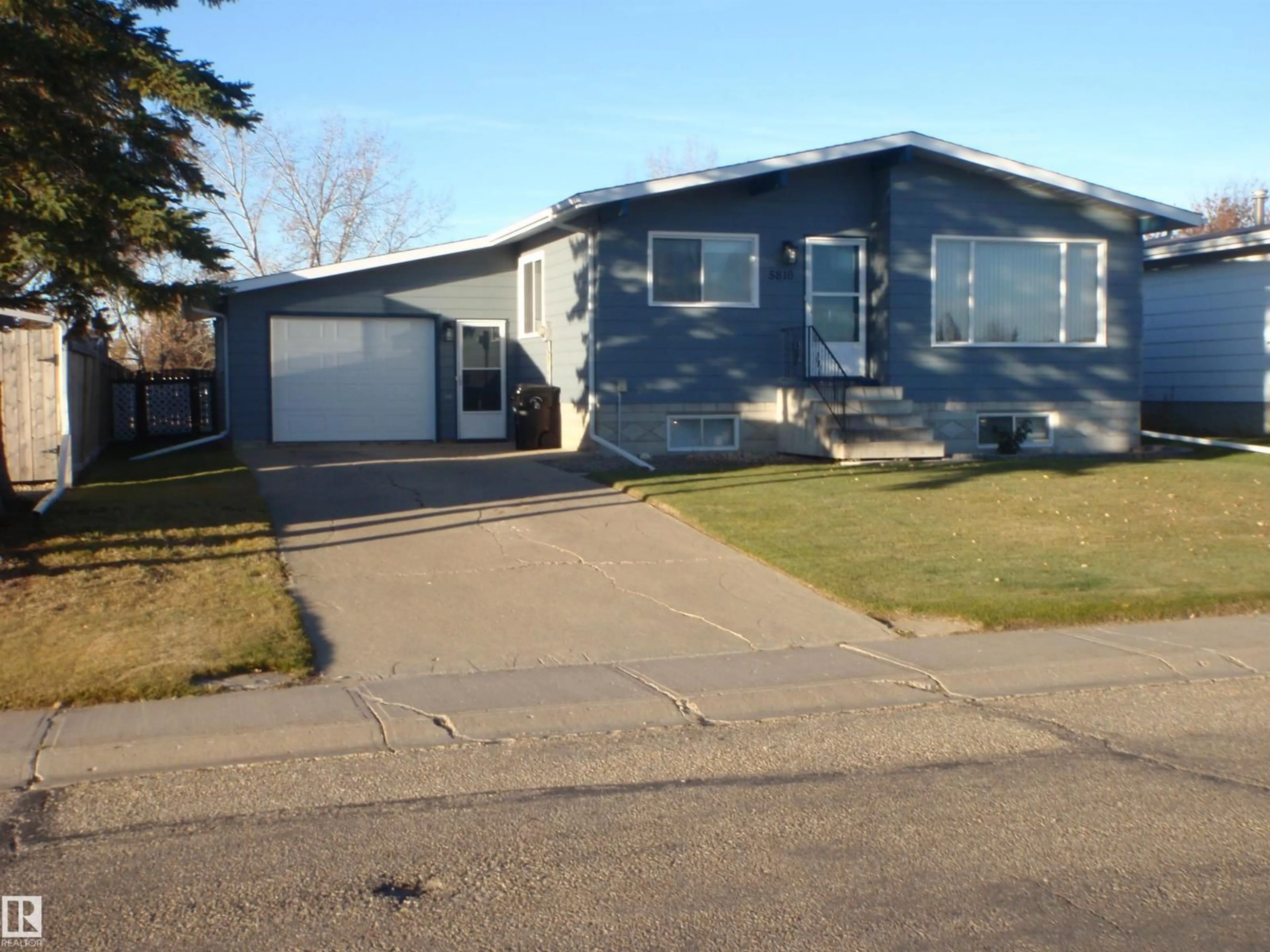 Home with vinyl exterior material, street for 5810 53 ST, Barrhead Alberta T7N1N1