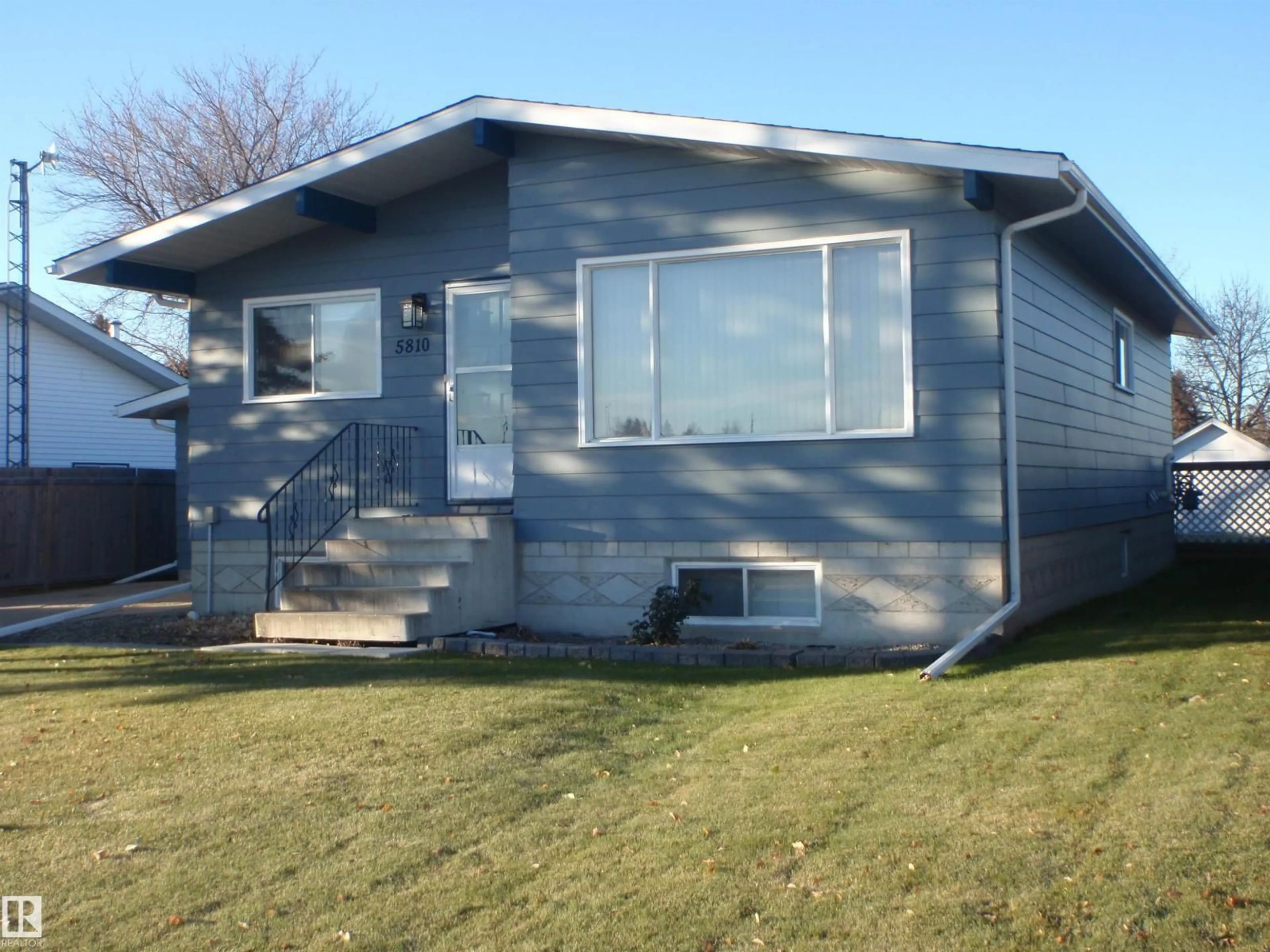 Home with vinyl exterior material, street for 5810 53 ST, Barrhead Alberta T7N1N1